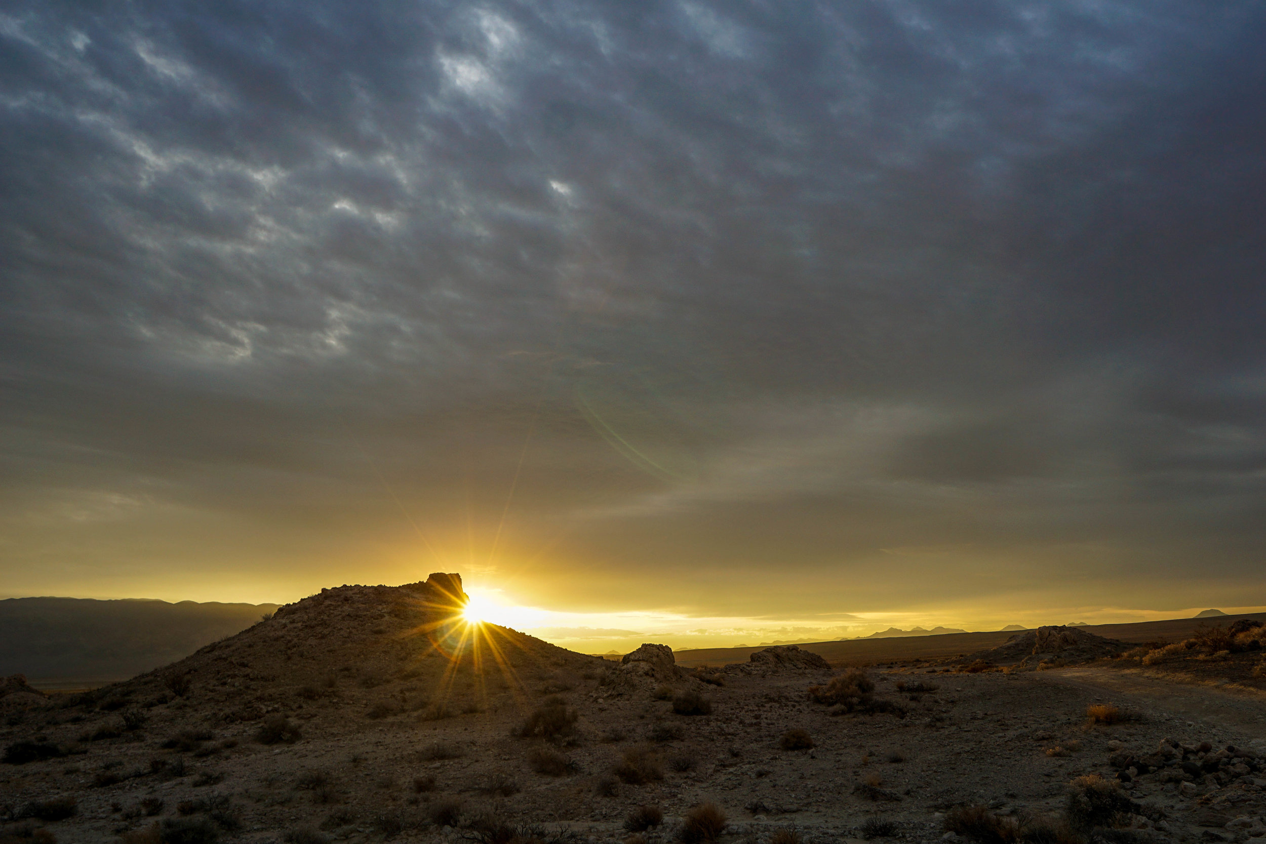 There's something mesmerizing about first light. The sun's warming kiss reappears after a night of cold, and in our case, a splash of rain.