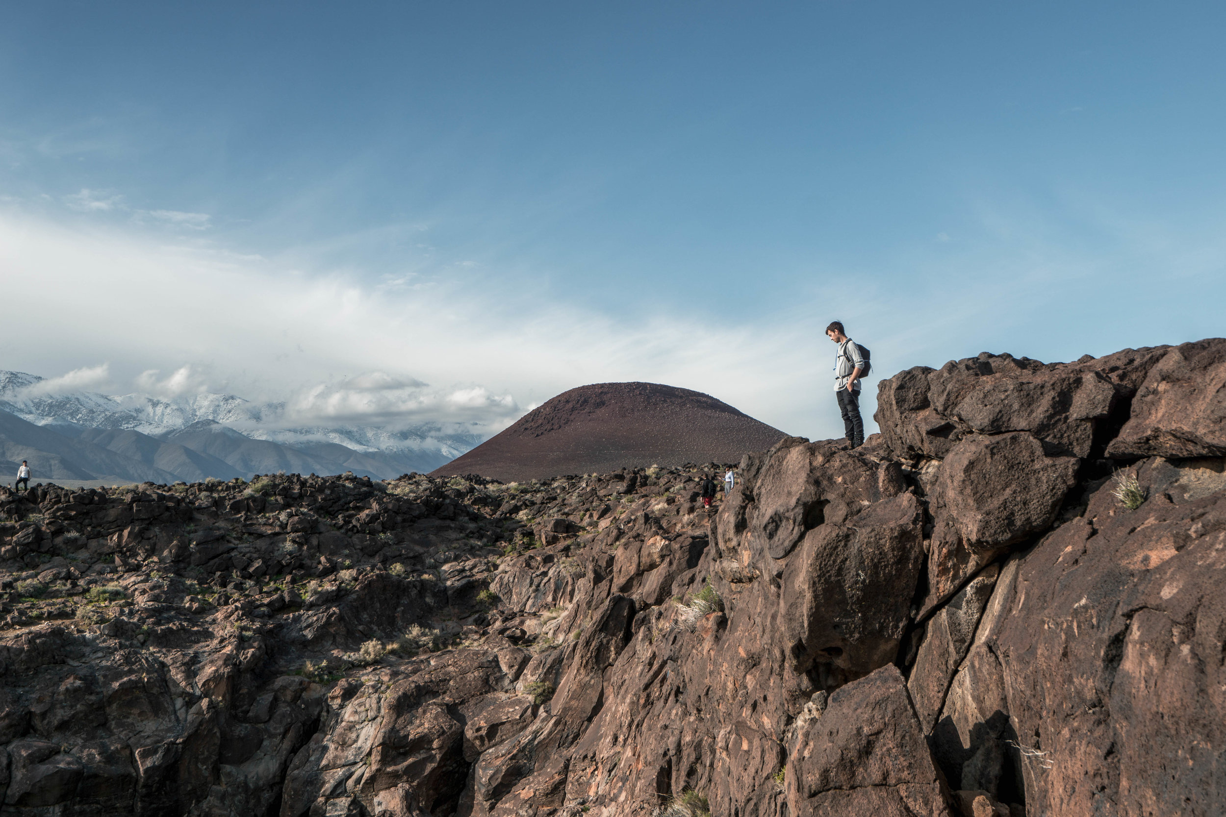 With a giant cinder cone looming behind, we look for a route to descend into the lava canyon.