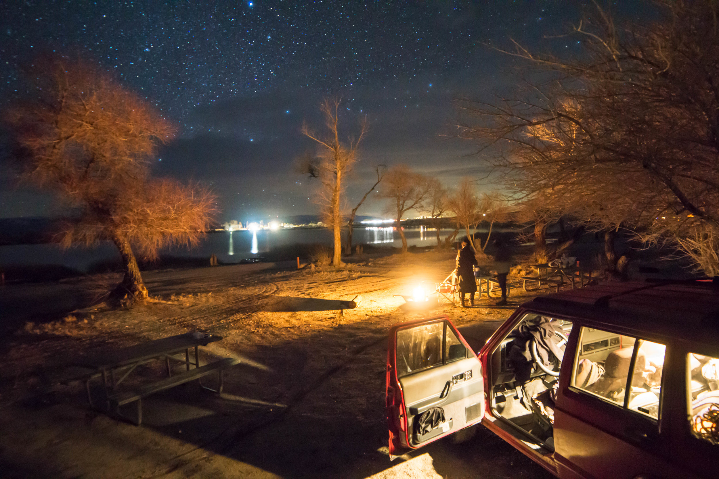 Back at camp, we warm ourselves around the fire as the stars peak behind the clouds to begin their nightly dance.