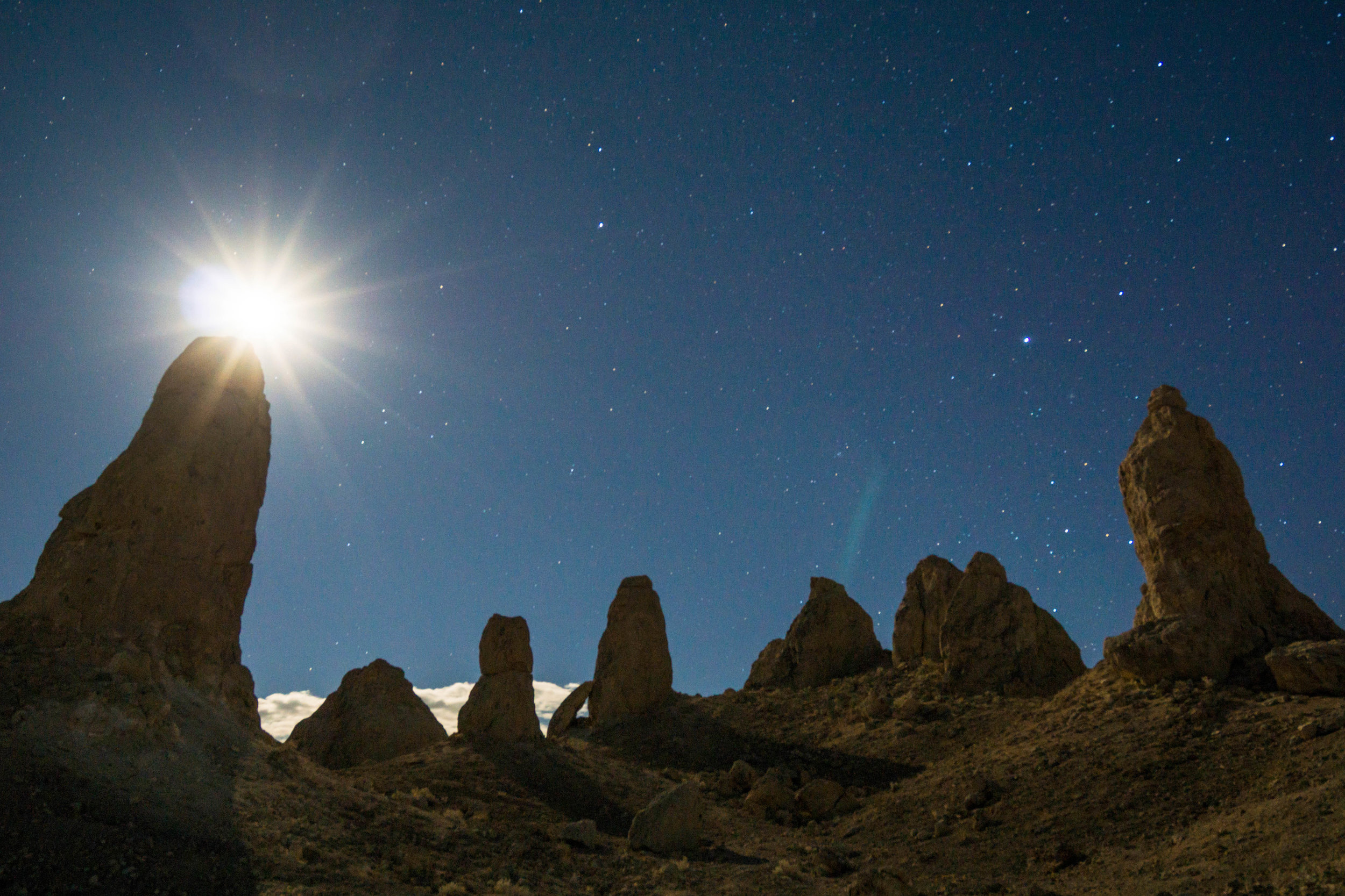After struggling to set up camp in an unrelenting wind, we embark on a hike under the moonlight through an array of pinnacles formed beneath an ancient inland sea.