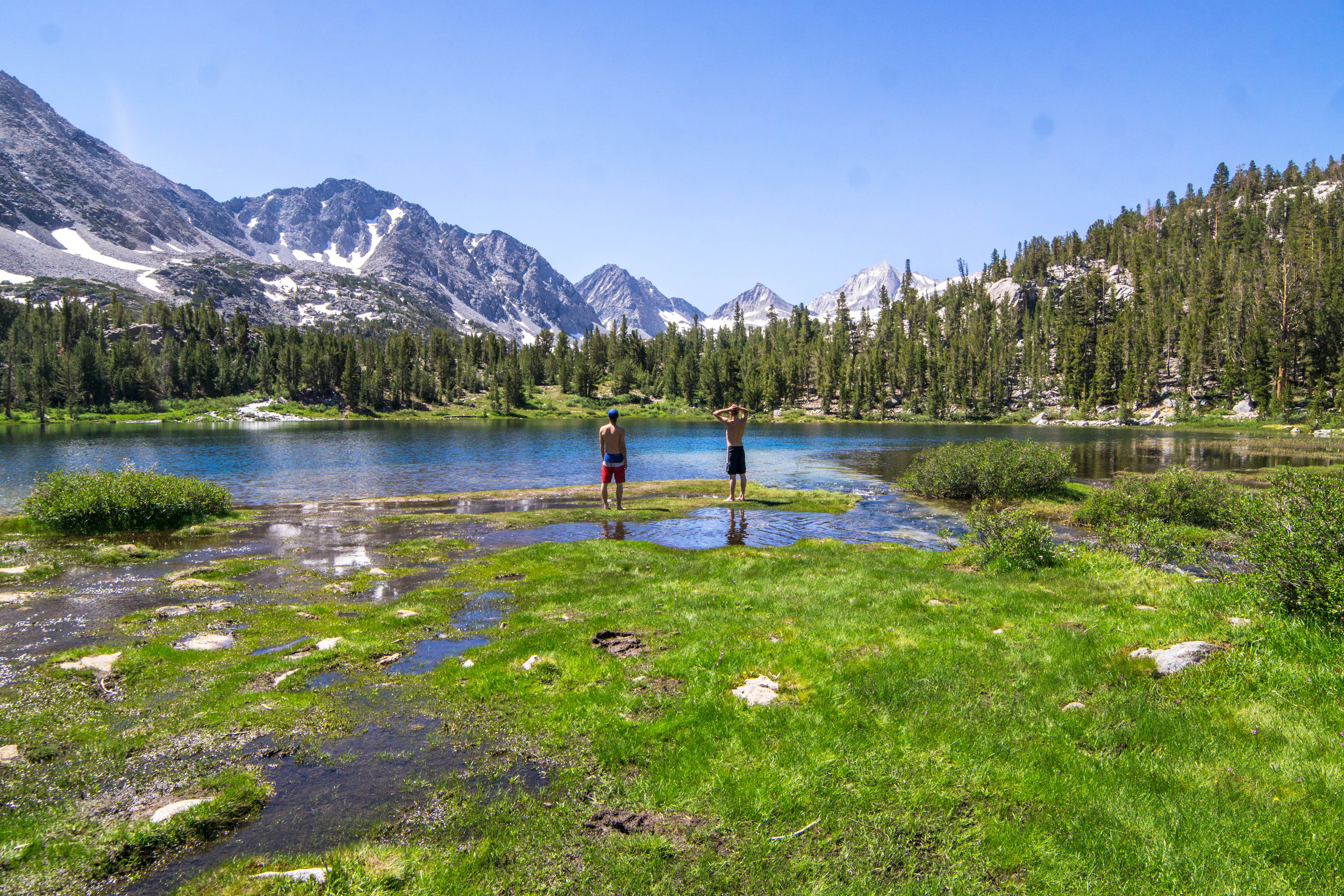 With temperatures rising, we eye a good place for an alpine swim along the trek back.