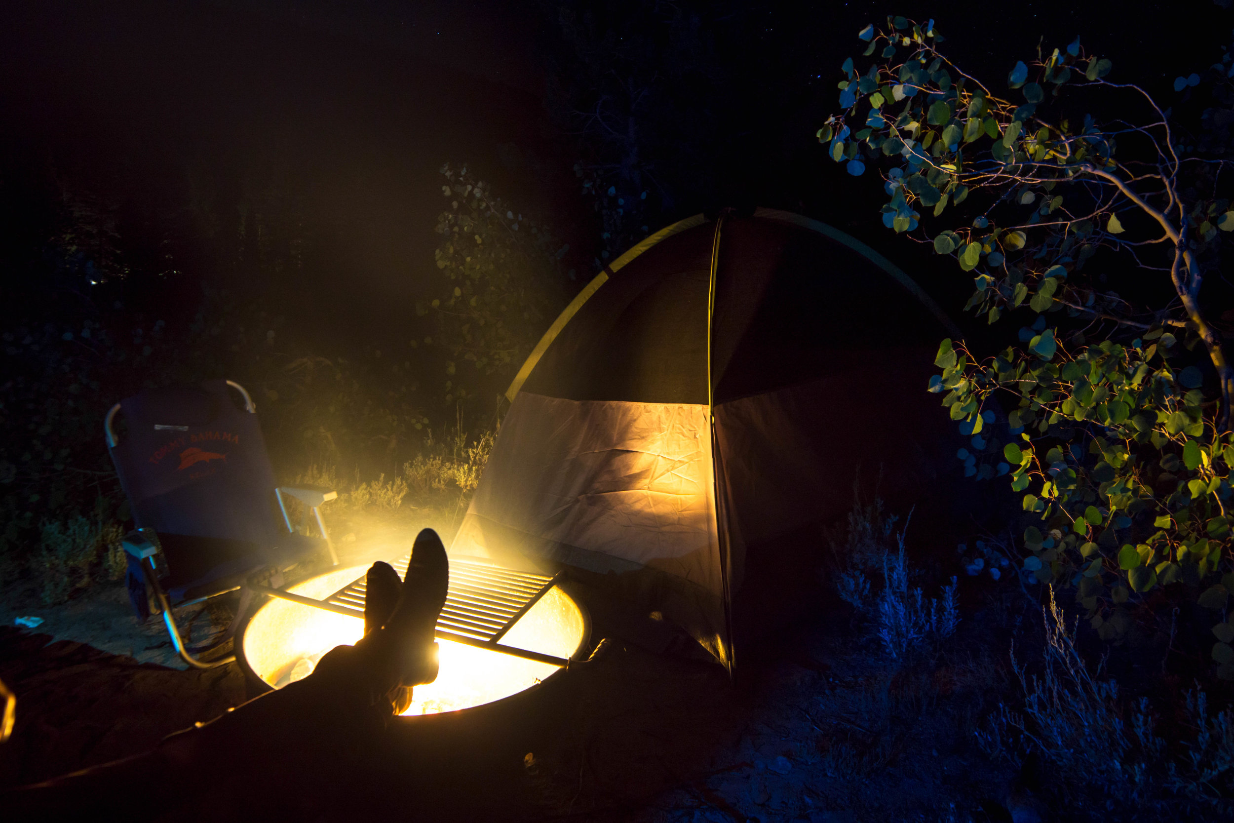 We put our feet up, exchanging stories &amp; listening to the sounds of critters rustling around our camp, cloaked in the shadowy night.