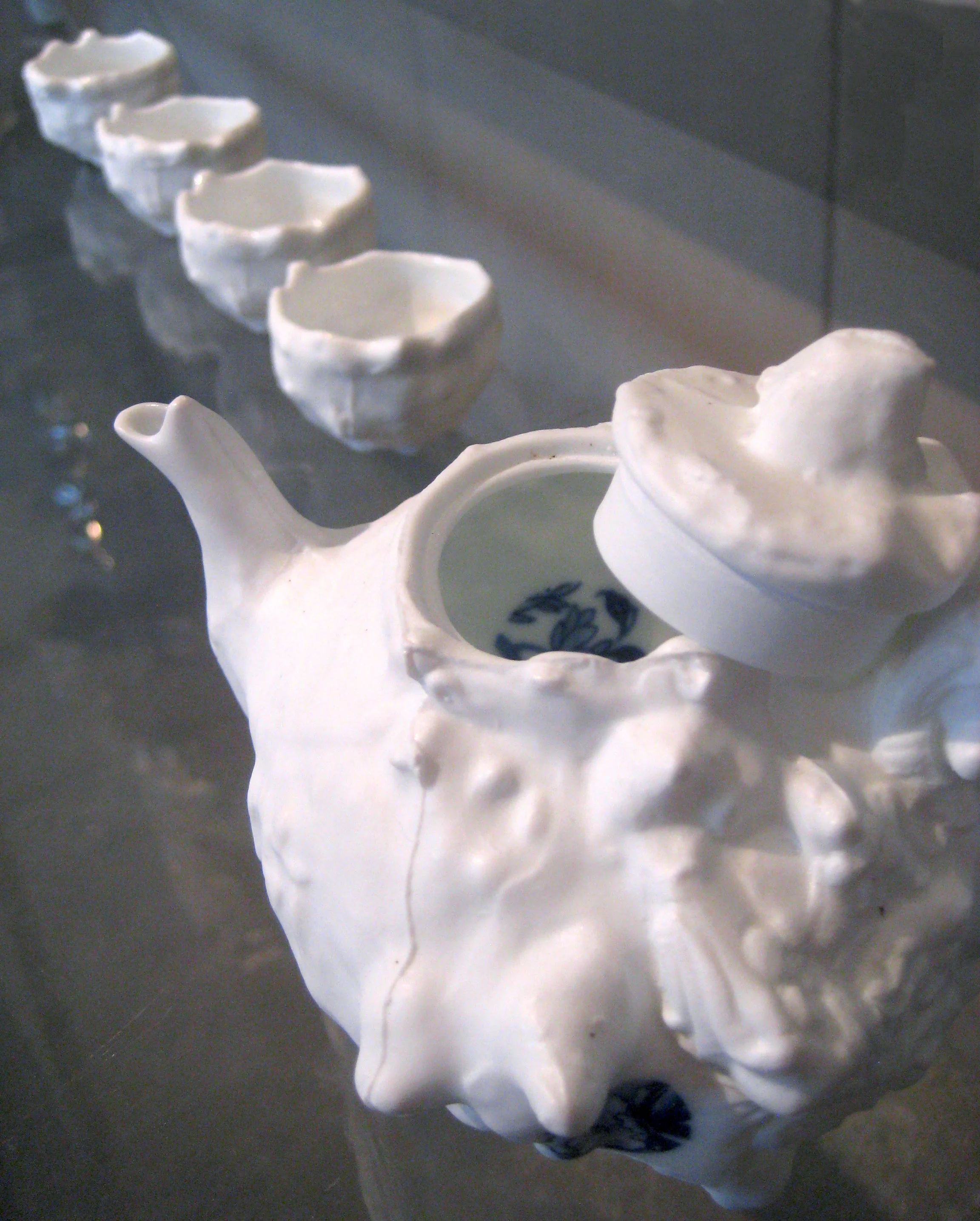 Porcelain, Ceramic decals Factory teapot coated with layers of wax, etc. and the help of an unusually eager mold-maker