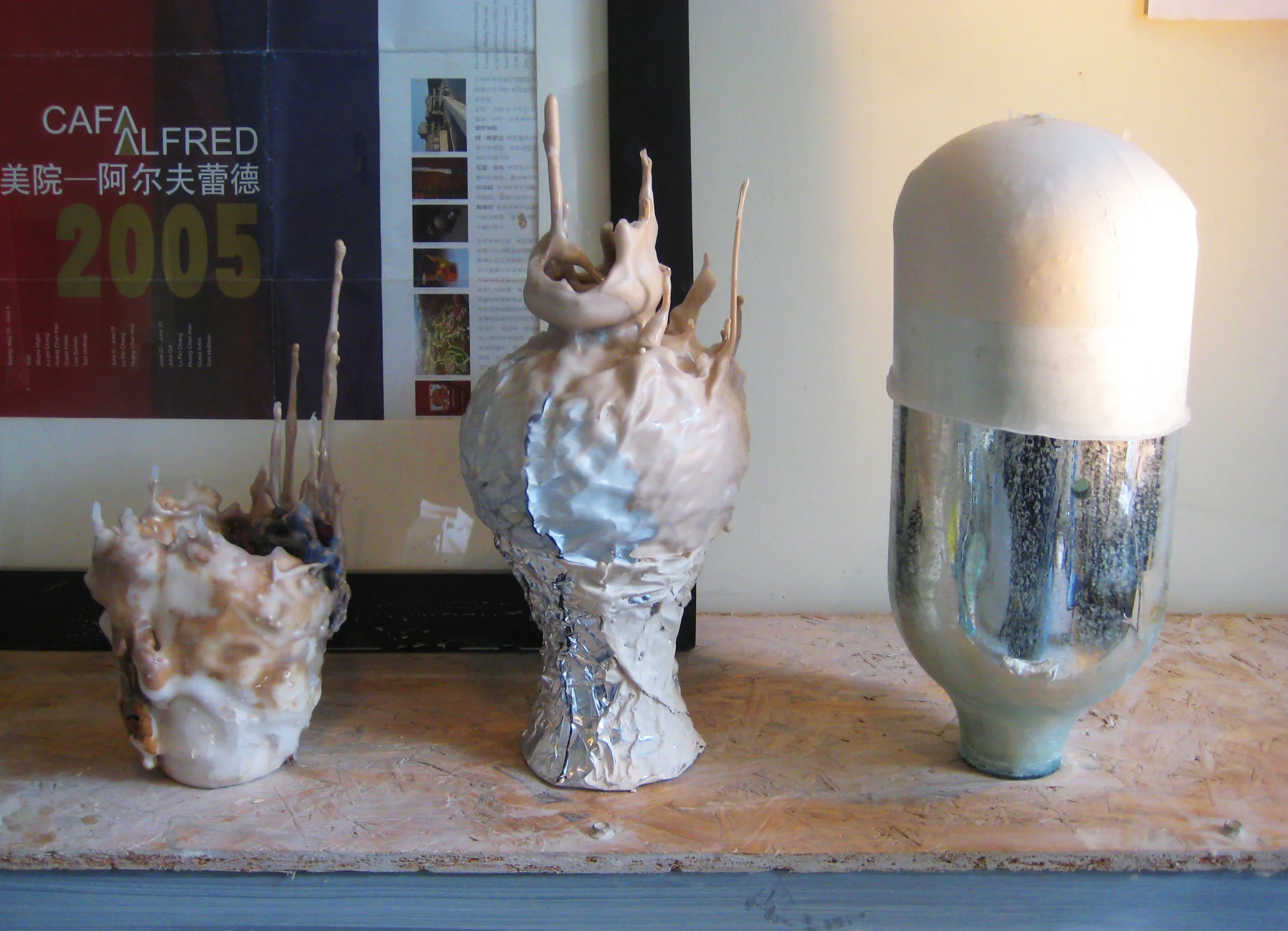 Unfired clay, wood Found objects, casting slip, aluminum foil, wax