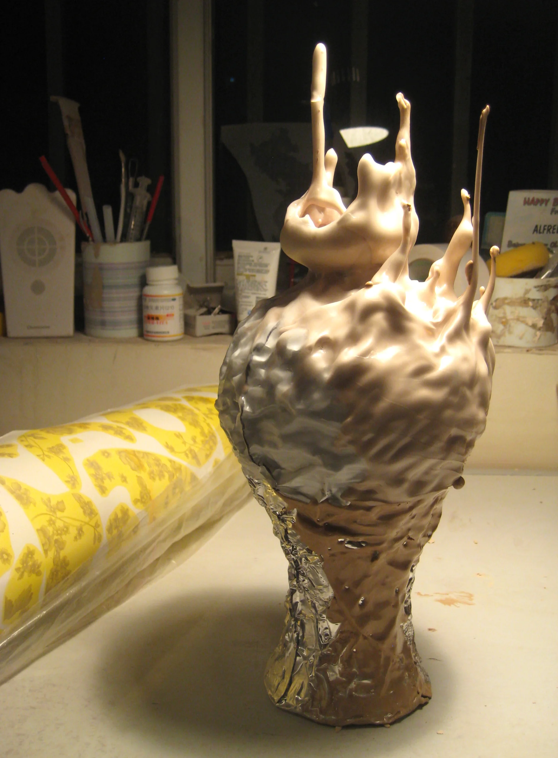 Found objects, casting slip, aluminum foil, wax