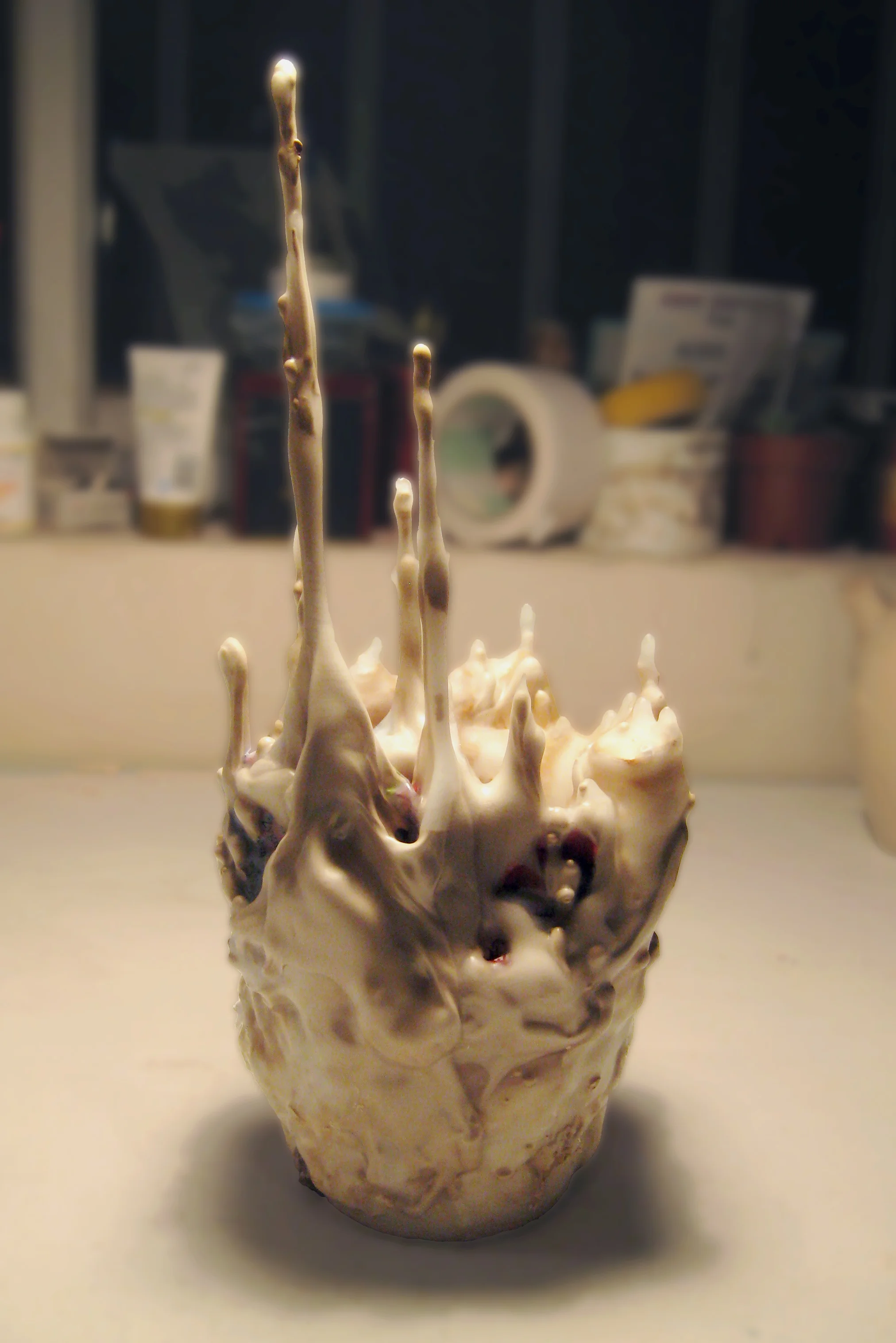 Found objects, casting slip, aluminum foil, wax