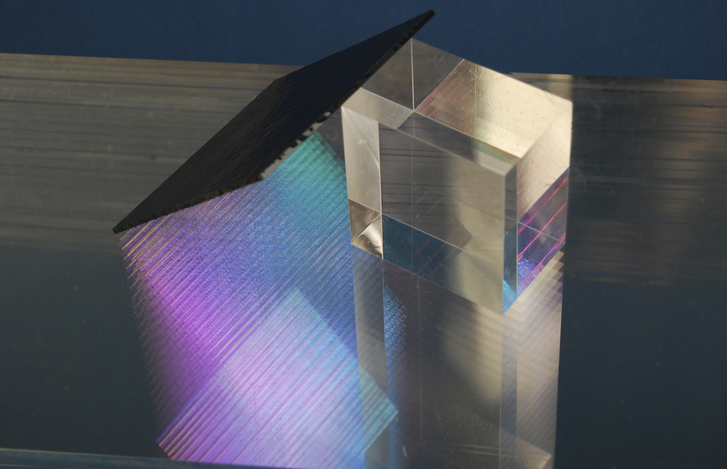 Diffusion Series Diffusion comprises a series of objects which build and construct with layers of light, creating analog holograms. The layered surface extrudes and suspends light, giving it a sense of volume and dimension. Materials: Acrylic, Optical glass, steel frame