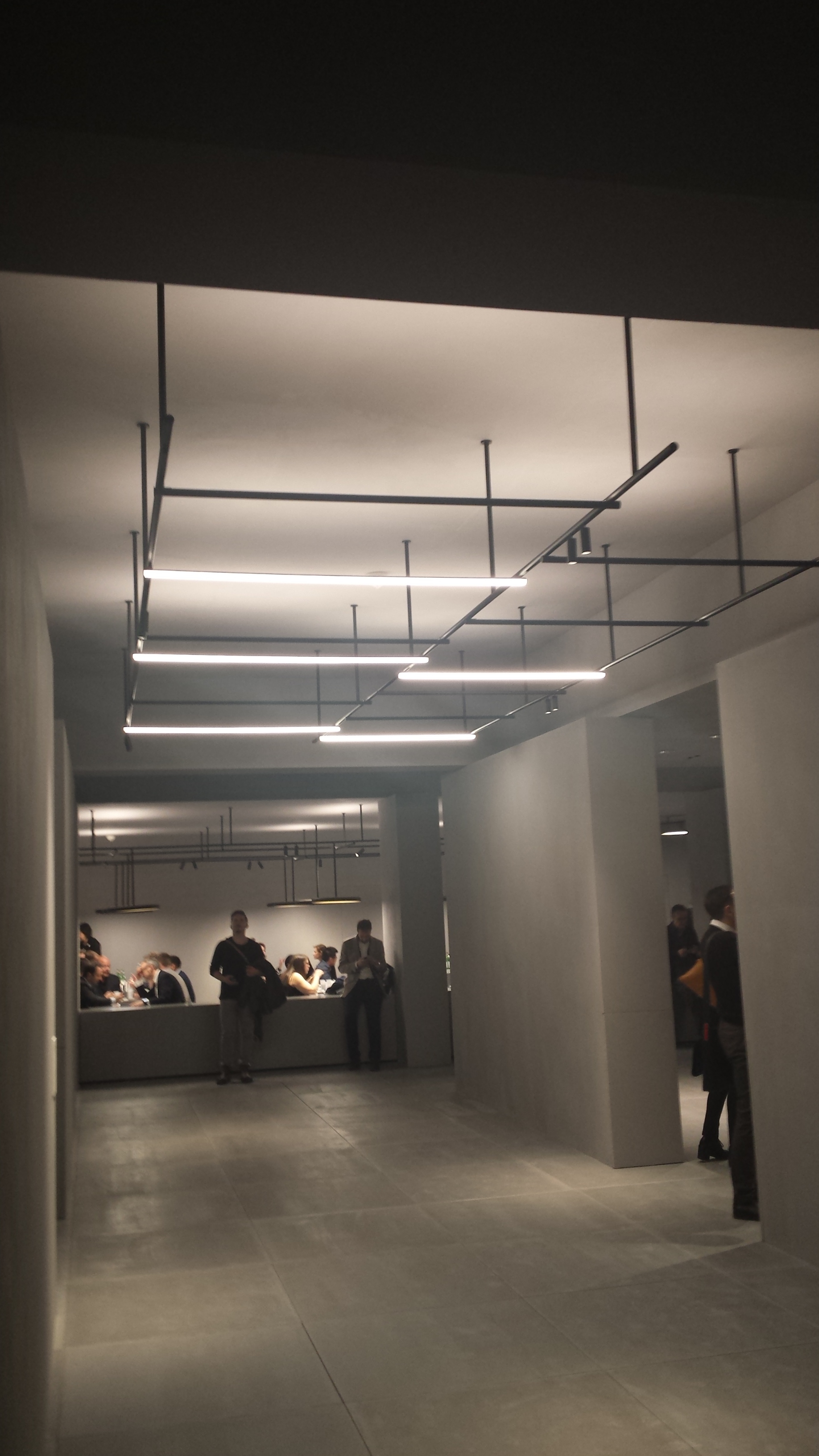 Industrial style modular LED structure with both direct and indirect light, as well as spotlights. 