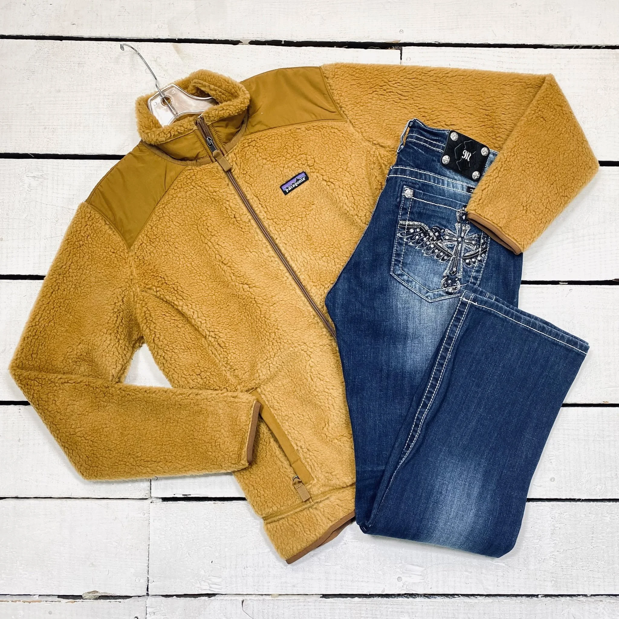 Patagonia Jacket Size XL, $84.95
Miss Me Jeans Size 14, $32.95