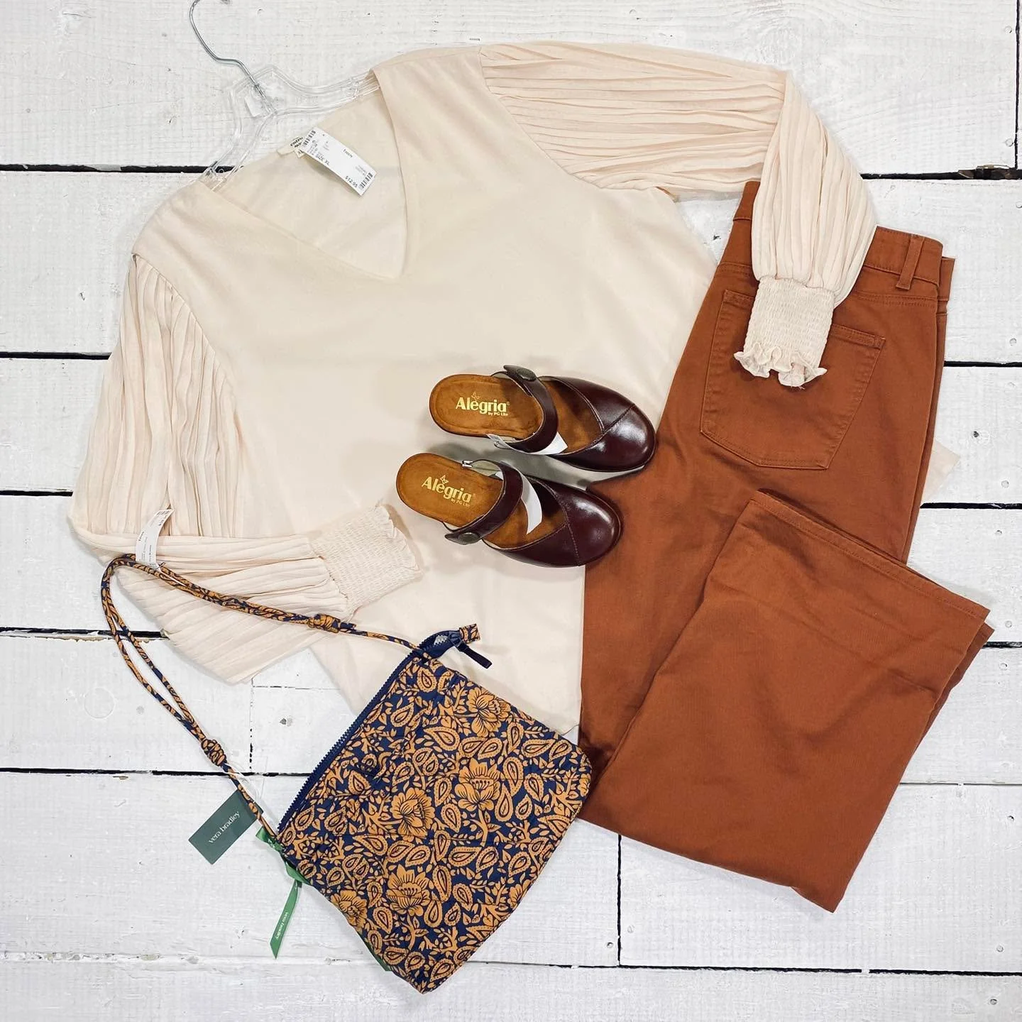 Entro Top Size XL, $12.95
Talbots Jeans Size 14, $18.95
Vera Bradley Purse, $38.95
Alegria Slides Size 6, $34.99