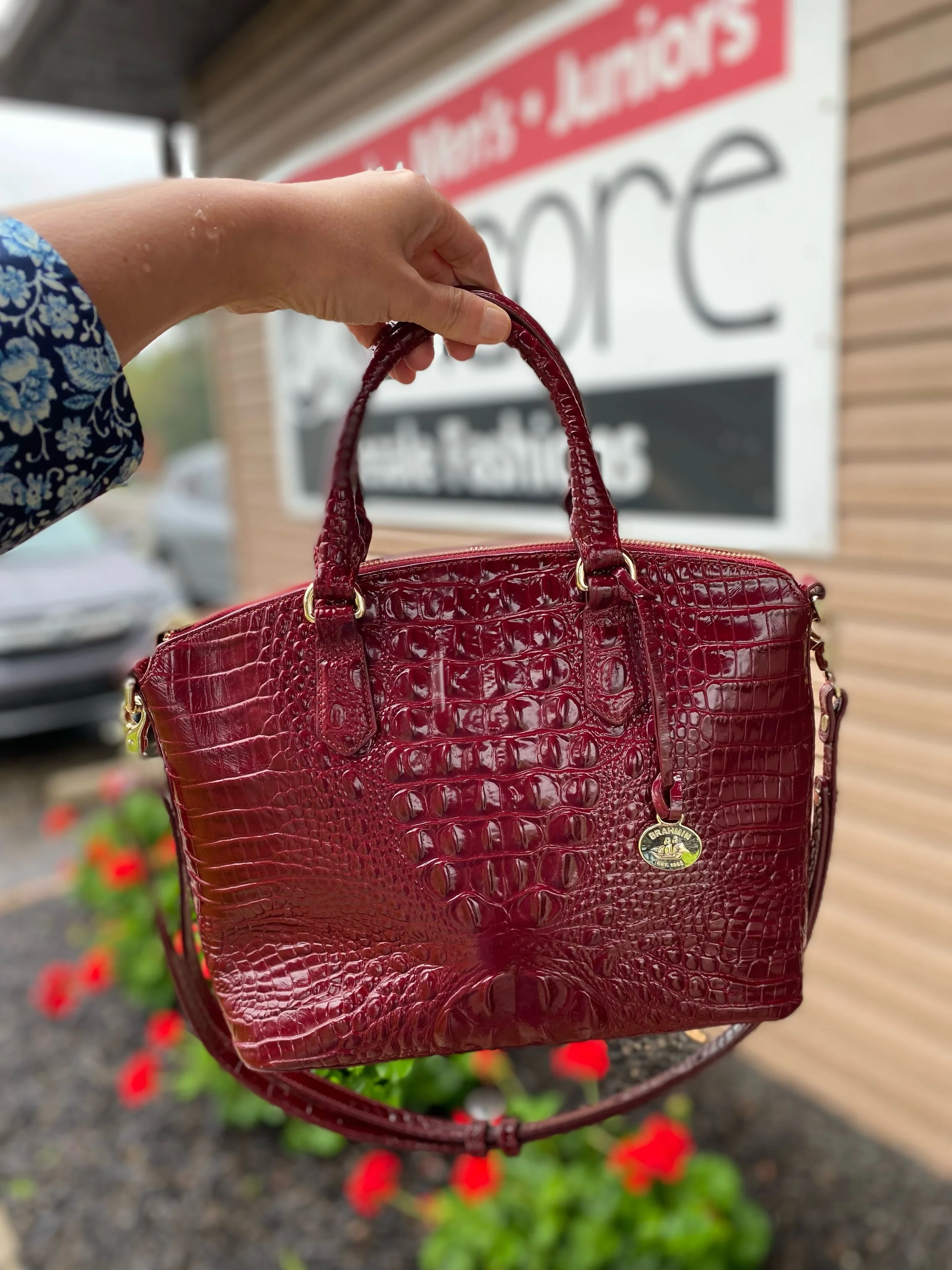 It&rsquo;s raining outside, but this purse is putting a warm smile on our faces! ❤️ Beautiful deep burgundy Brahmin with gold hardware, this beauty is just $185.99! 🤩