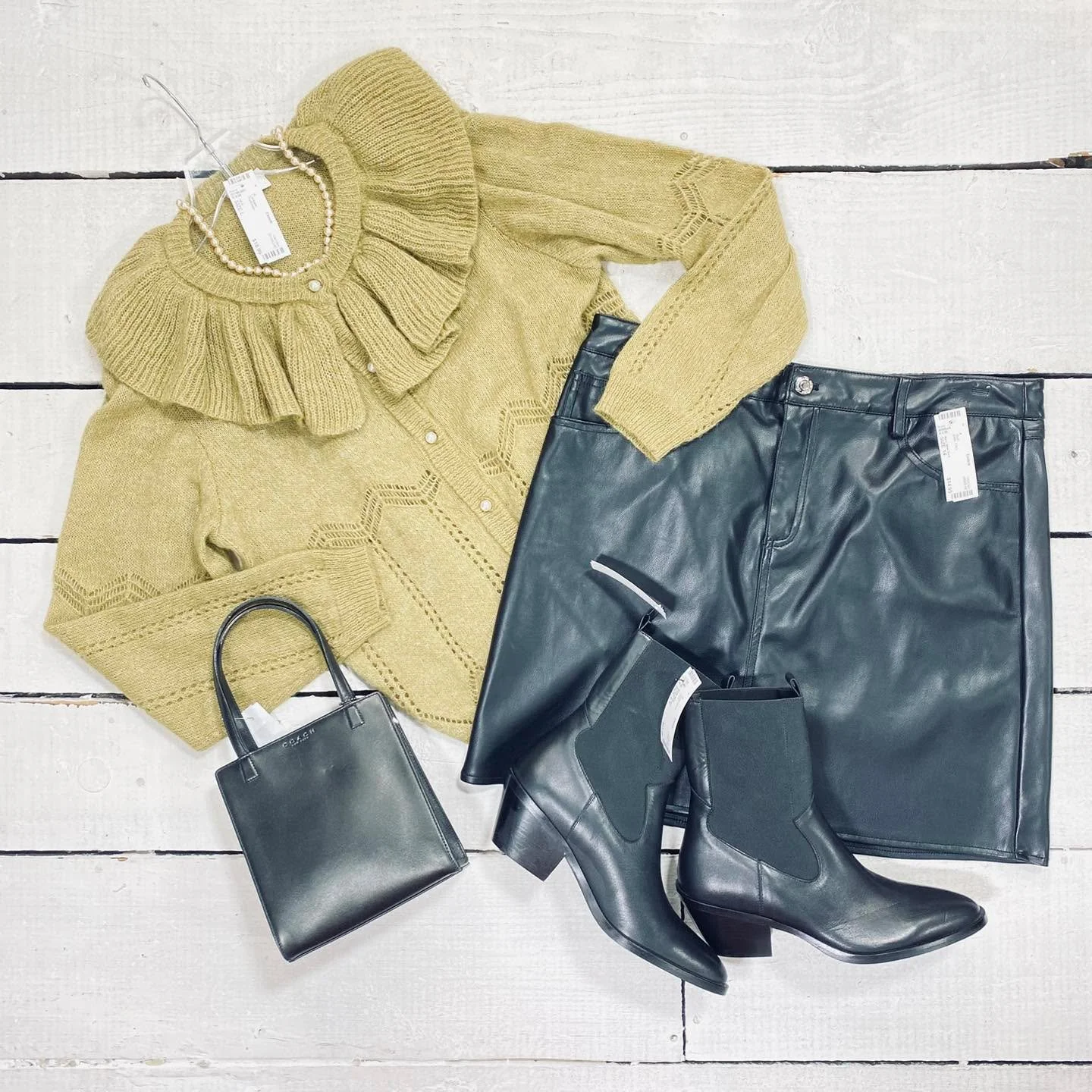 VILA Cardigan Size L, $18.99
Marc New York Skirt Size 14, $14.95
Anthropologie Ankle Boot Size 8.5, $65.99
Coach Purse, $92.99
Necklace, $8.99