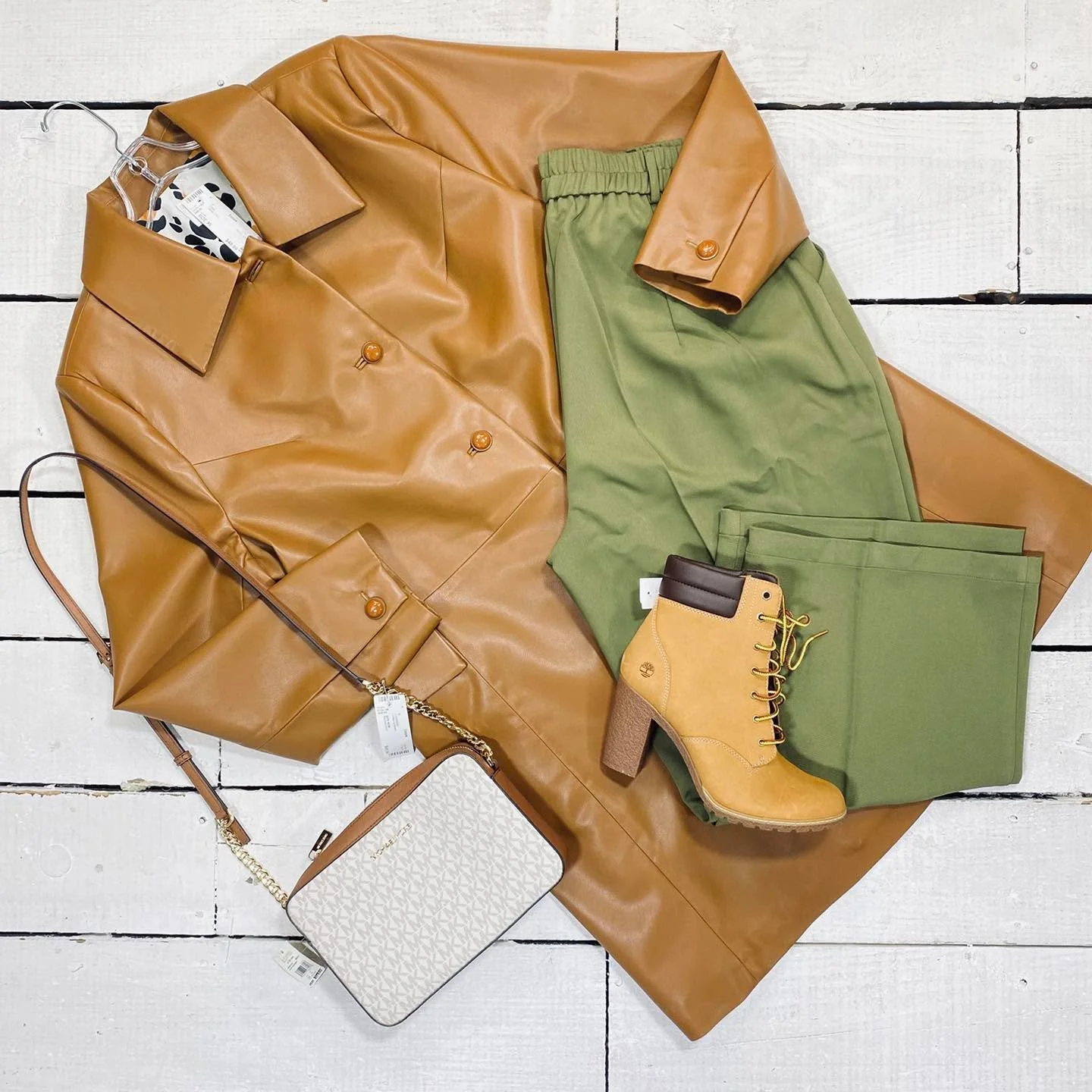 Cabi Coat Size XL, $48.99
Funyzo Pants Size 16, $11.99
Timberland Ankle Boot Size 9, $40.99
Michael Kors Crossbody, $98.99