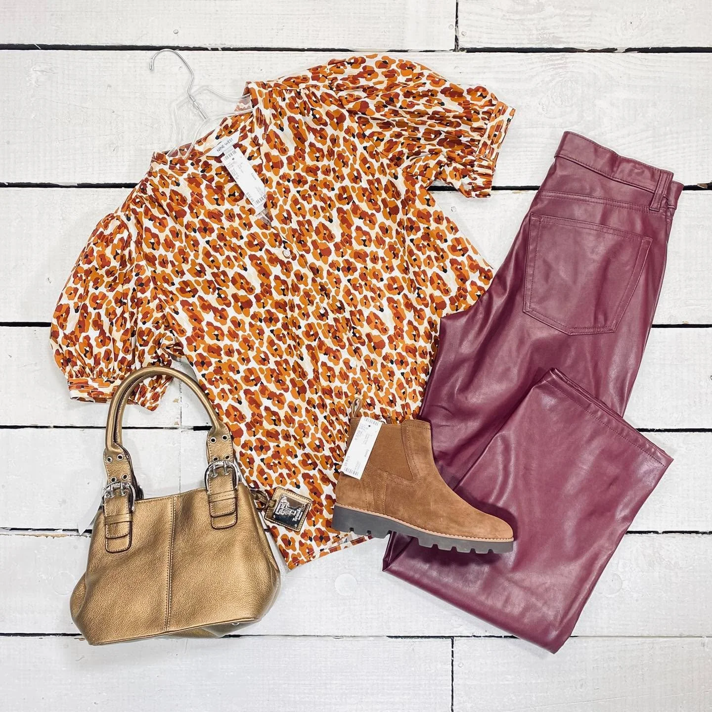 Nine West Top Size M, $12.95
Universal Thread Pants Size 2, $16.99
Vionic Ankle Boots Size 6, $34.95
Tignanello Purse, $24.99