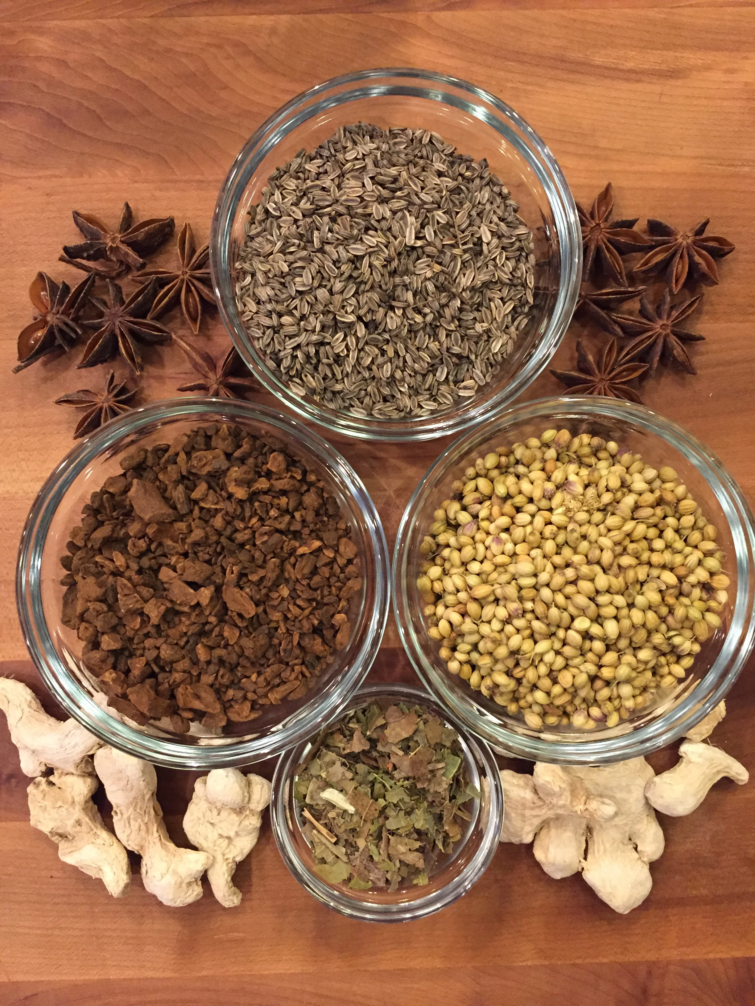 Almost all of the above can be sourced locally. In the bowls, from top, clockwise: black fennel seed, coriander seed, black walnut leaves, and chicory root. On the board, from top, star anise and dehydrated ginger.