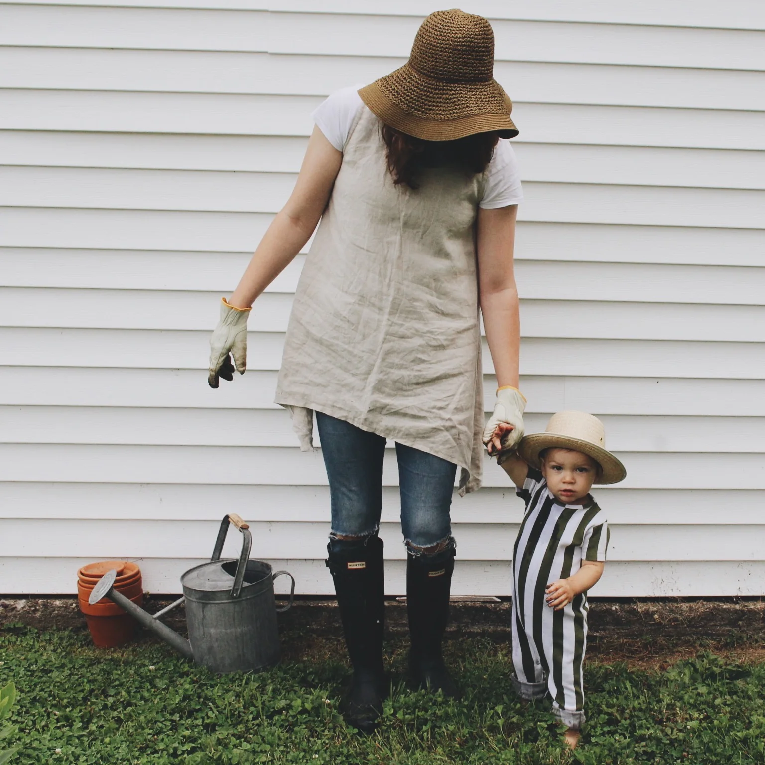 On Tad: Romper - Tiny Cottons ( @tinycottons ) c/o Murray and Finn ( @murrayandfinn ) // On Me: Sunhat - Urban Outfitters; Linen Tunic - Under A Tin Roof (@underatinroof); Wellies - Hunter Boots