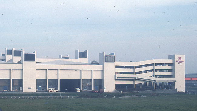 The Shopping City with original white tile cladding and 'egg timer' logo