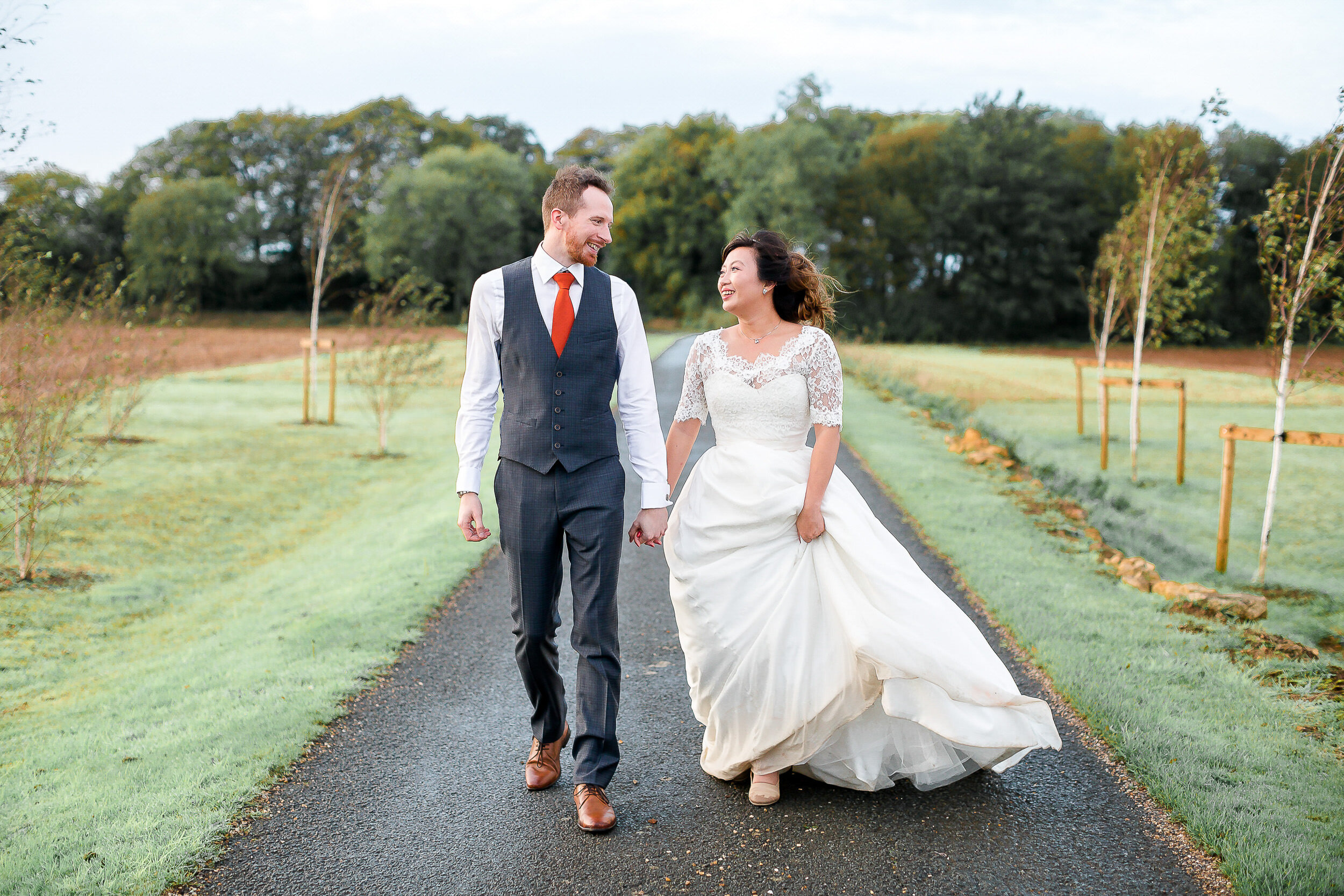 bride-groom-natural-walking-lapstone-barn-cotswold.jpg