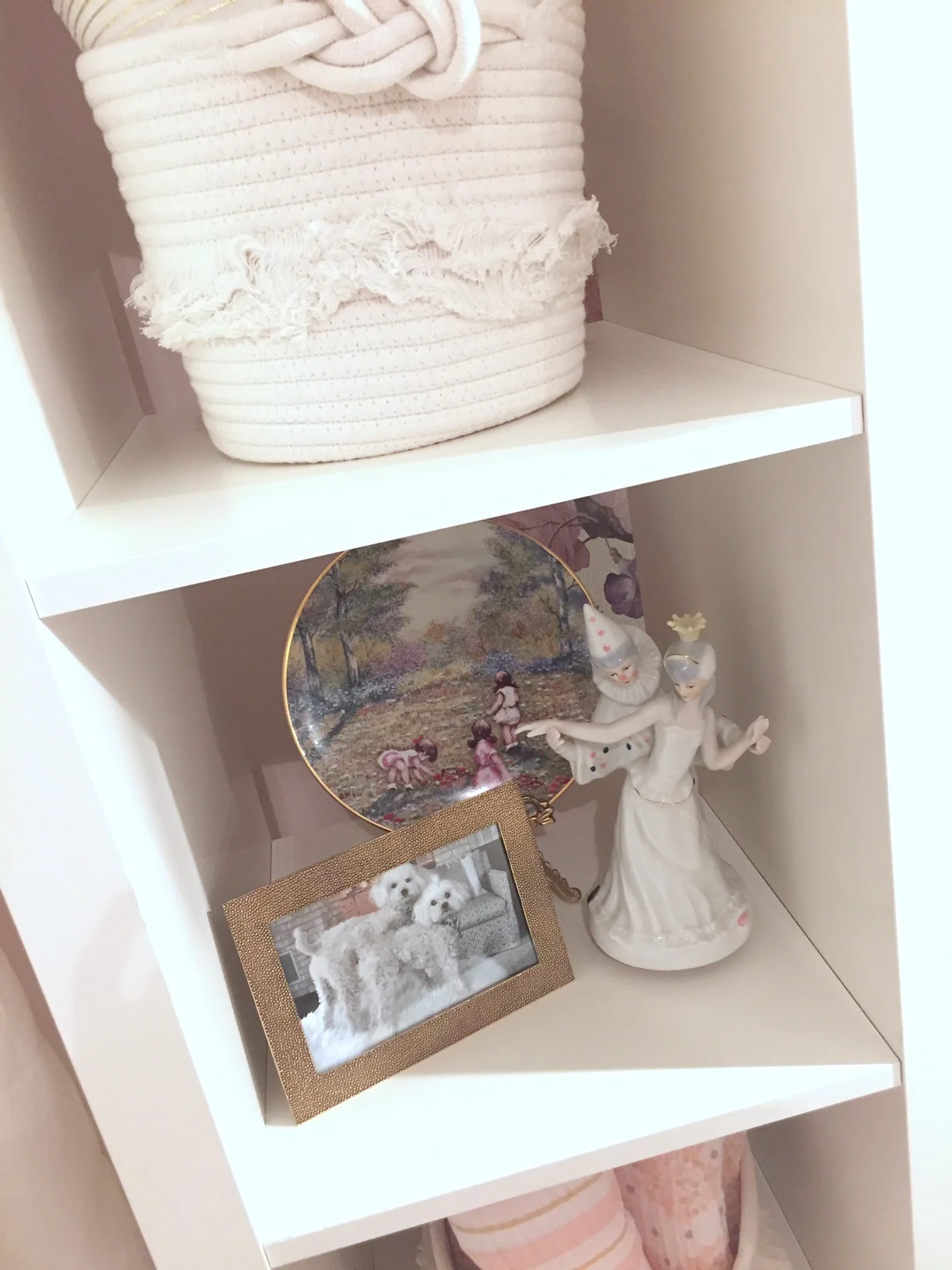 A shelf of memories holds a special plate that was given to my Mom when I was born and a music box figure that was given to me by my Aunt. Always find a way to add in the person details that make a space special.