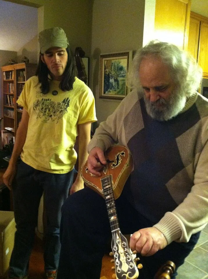 David Grisman showing Stash one of Ira Louvins' mandolins