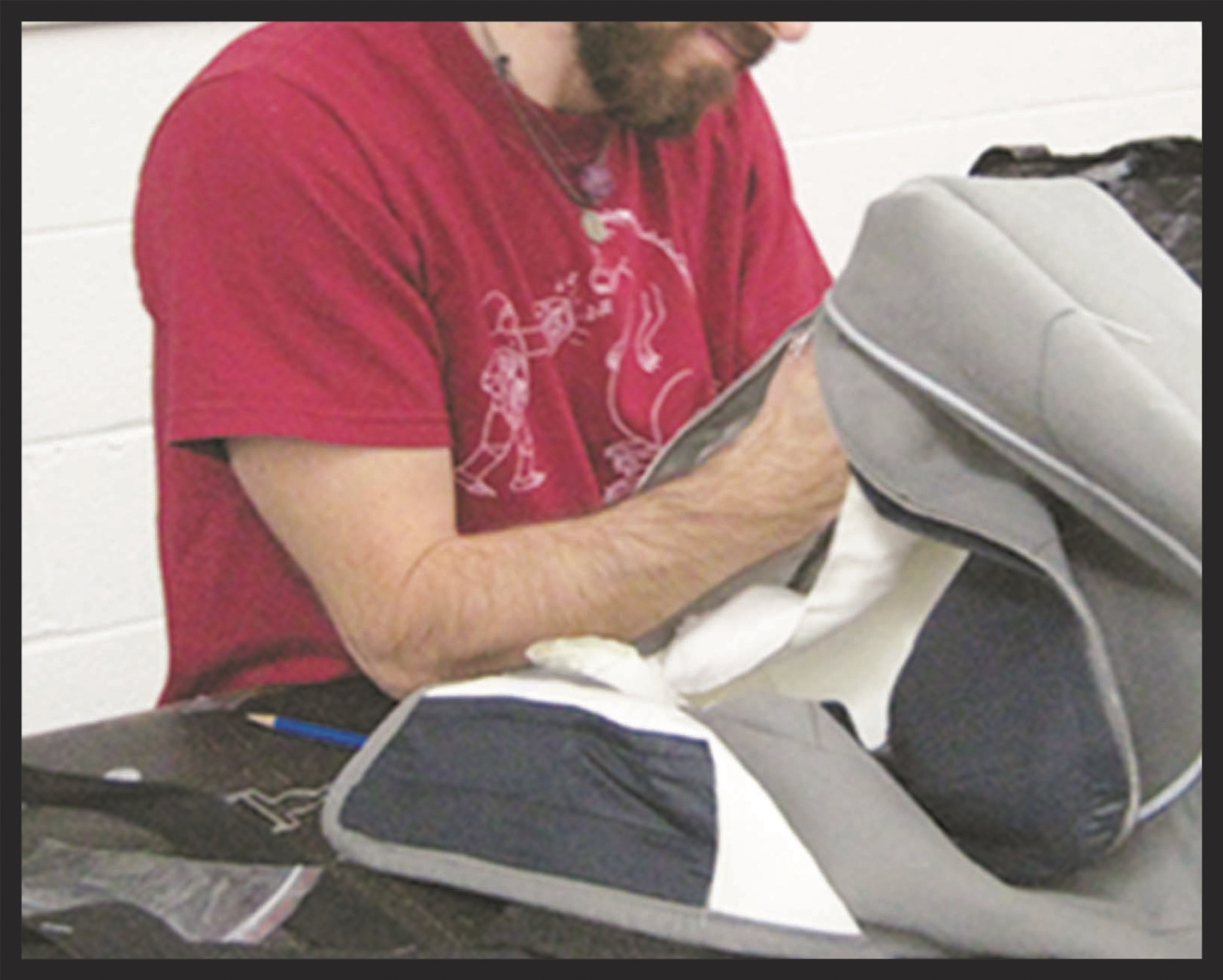 Sewing liner into weekend bag concept.