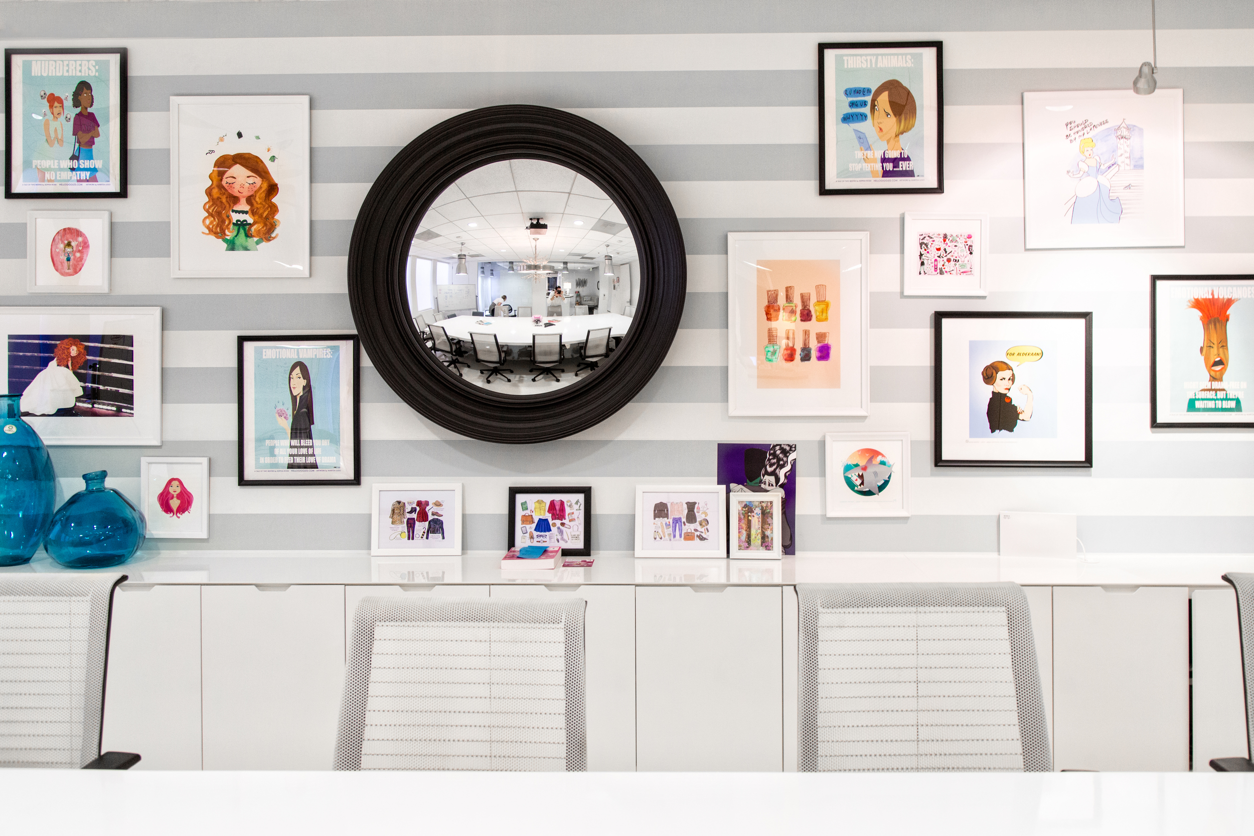 Contributor artwork hangs on the wall. 