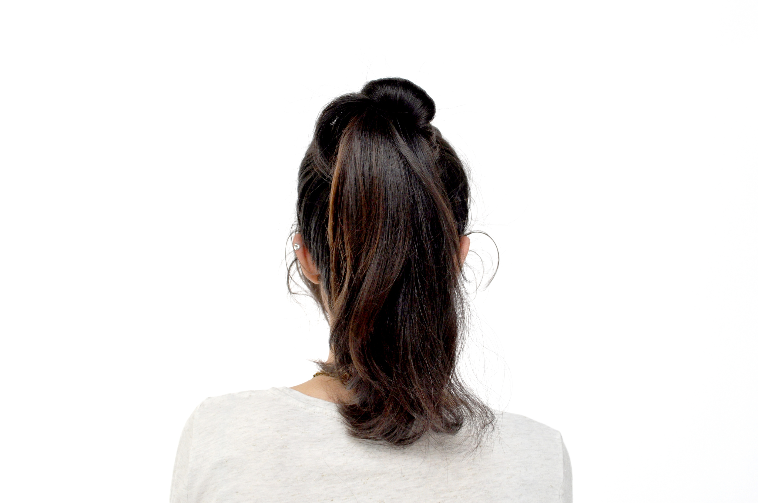  Take one section of your pony tail and wrap it around the base. For a messier effect, loosely wrap the section around the base and secure the end with a bobby pin. 