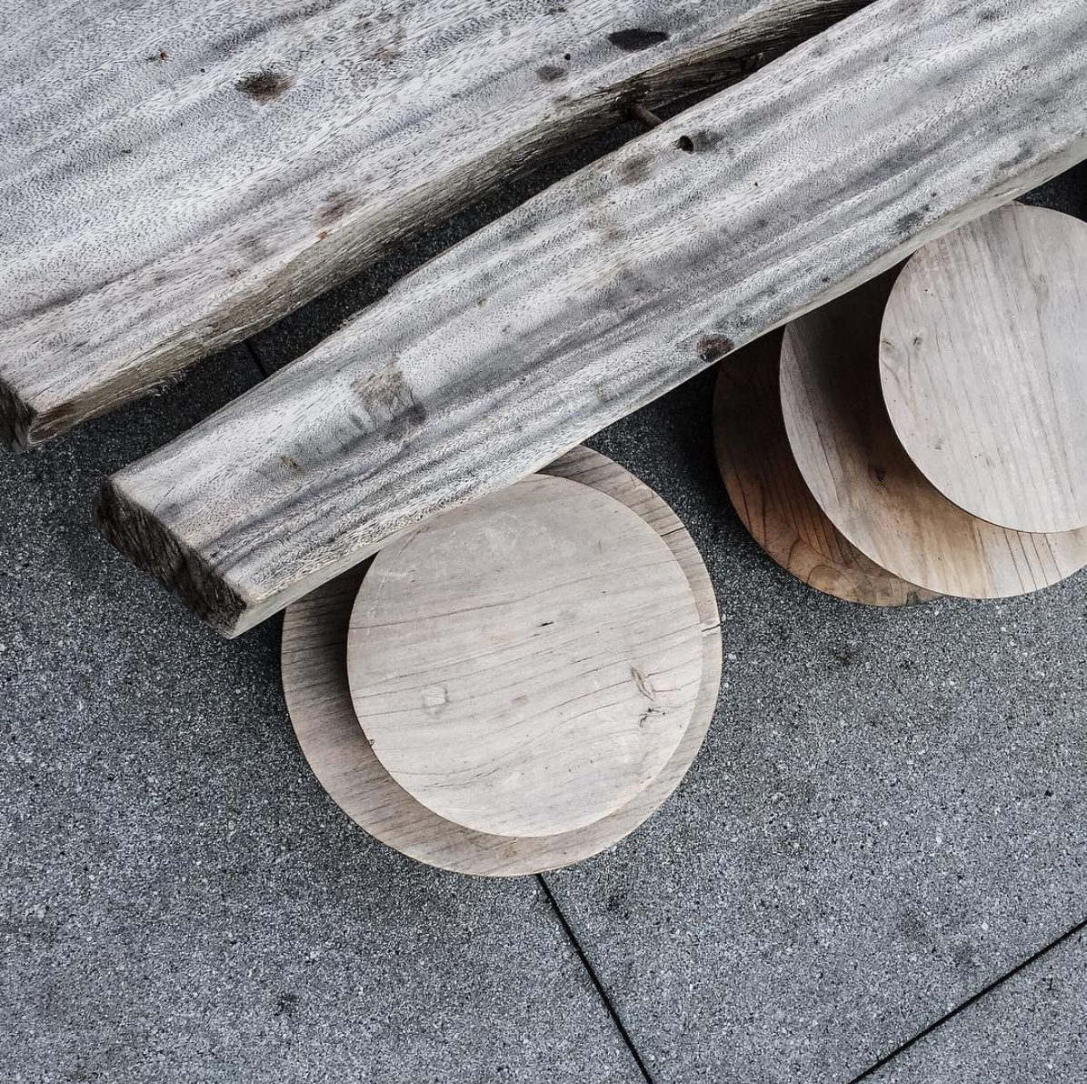 The Bonnie Brae Terrace on the north side of the hotel features a terrace full of palms surrounding this natural wood communal table. Credit: Johnny Simpson