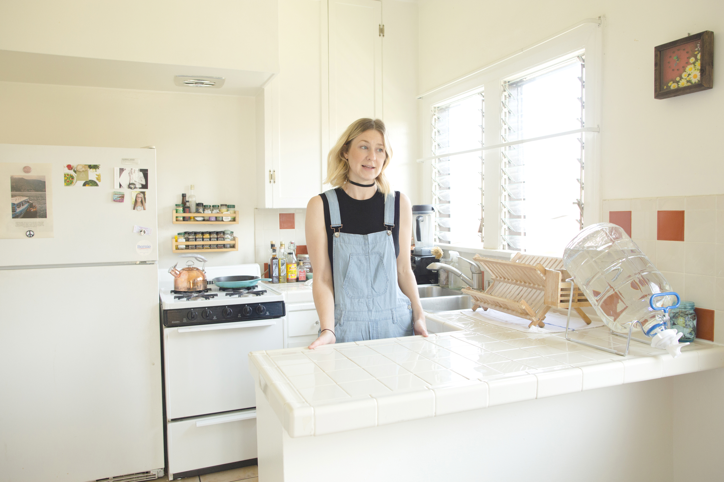   The place where it all started. To her left, a zero-waste alkaline glass water jug.  