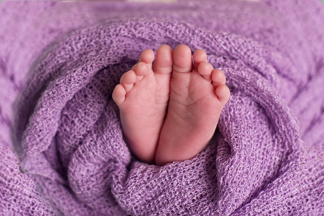 close up of newborn feet
