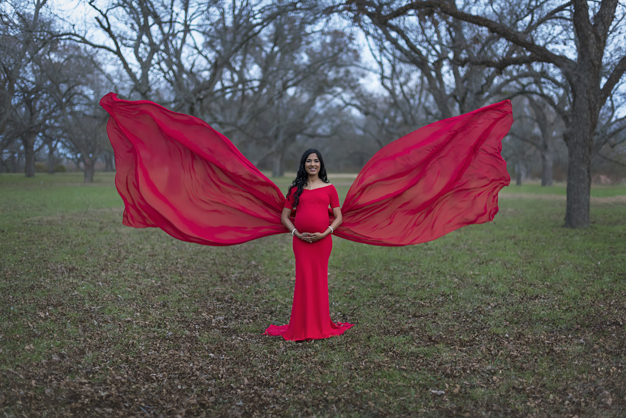 Red maternity gown at dusk 