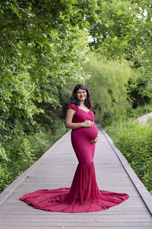 red gown on boardwalk