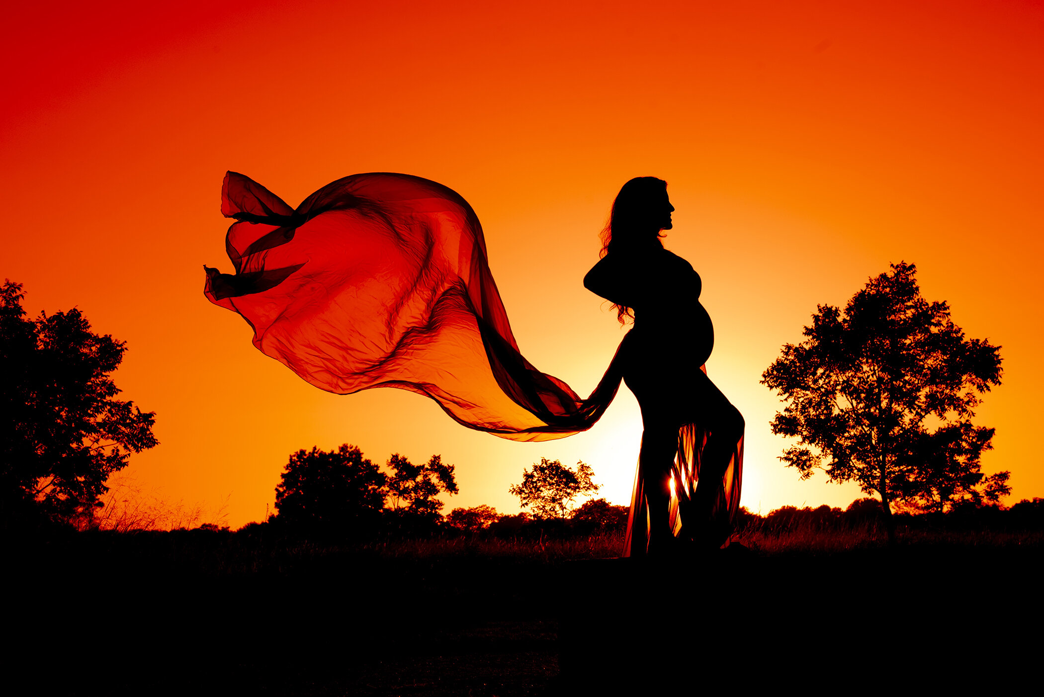fiery sunset silhouette maternity 