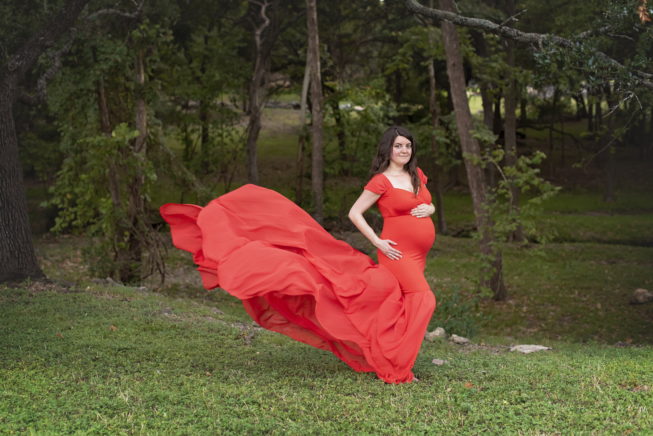 red flowy gown dark woods