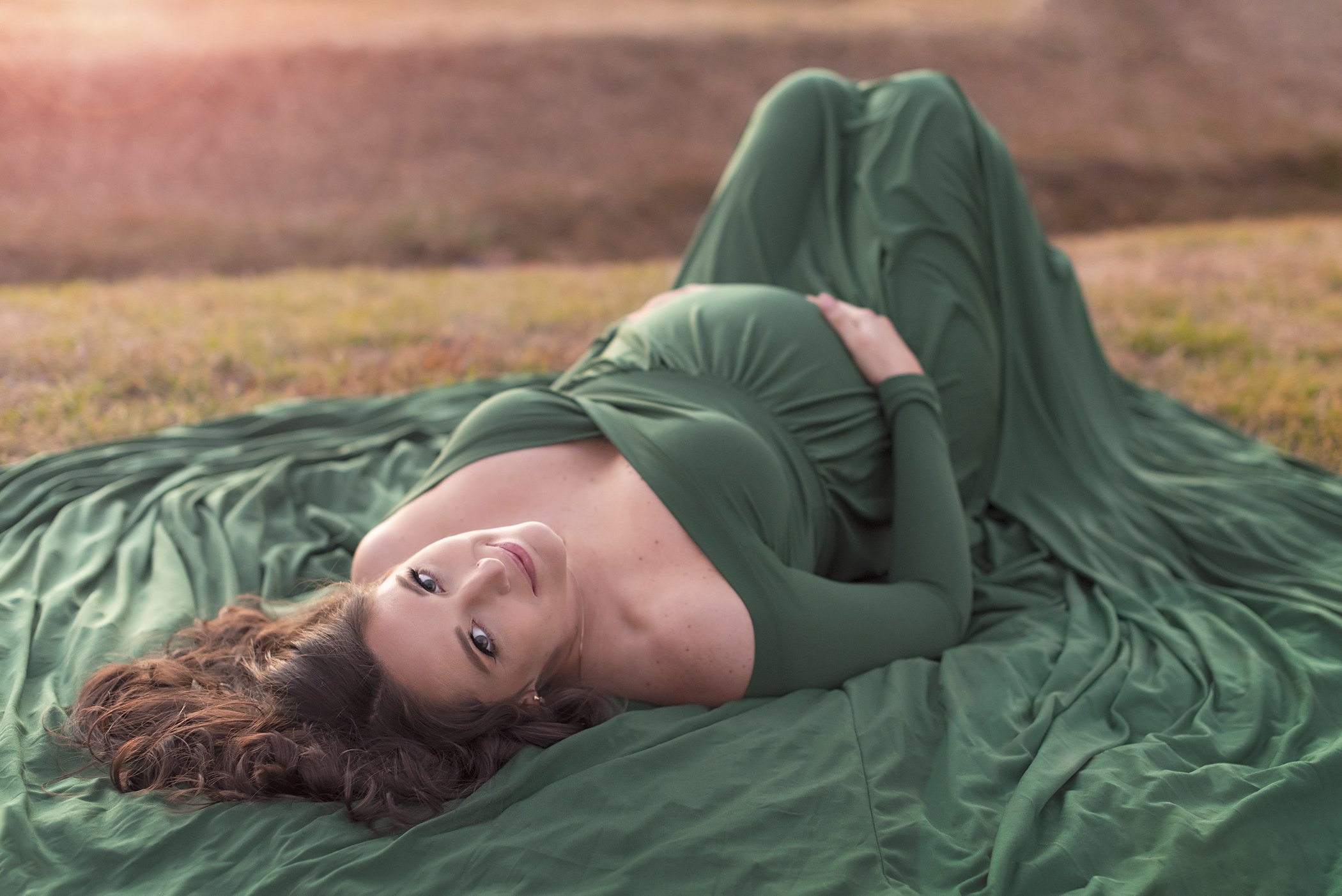 lying down pose outdoor maternity