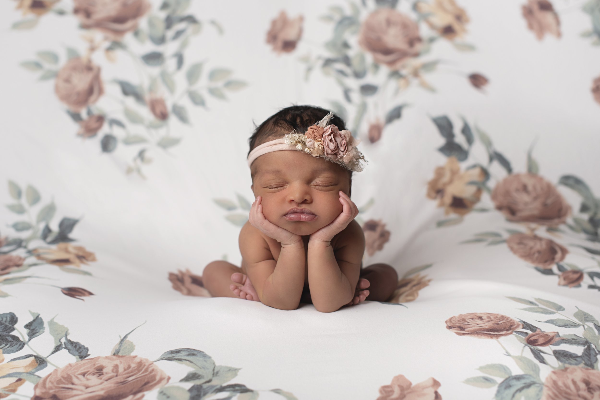 floral background froggy pose newborn