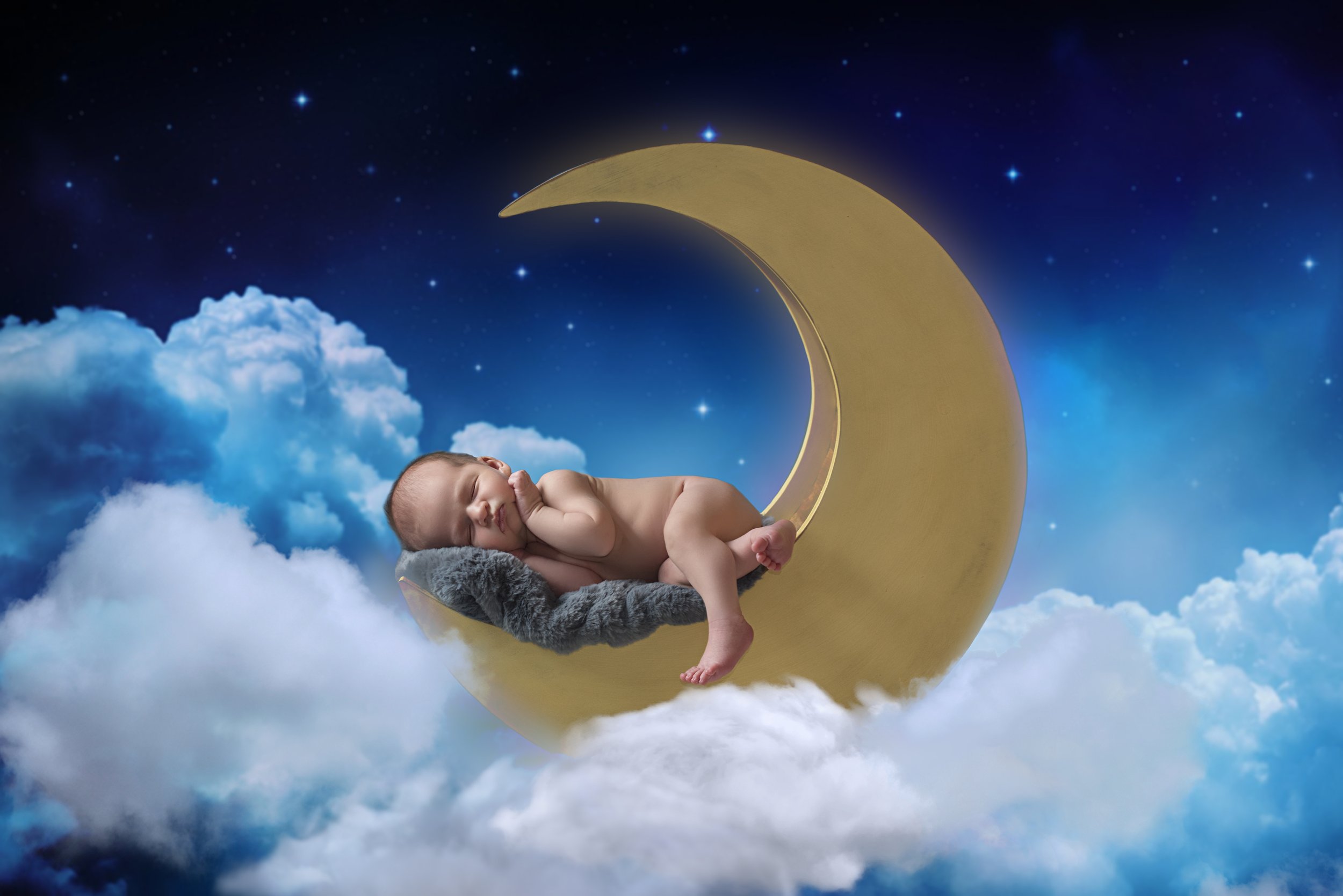 over the moon newborn baby photos in Austin