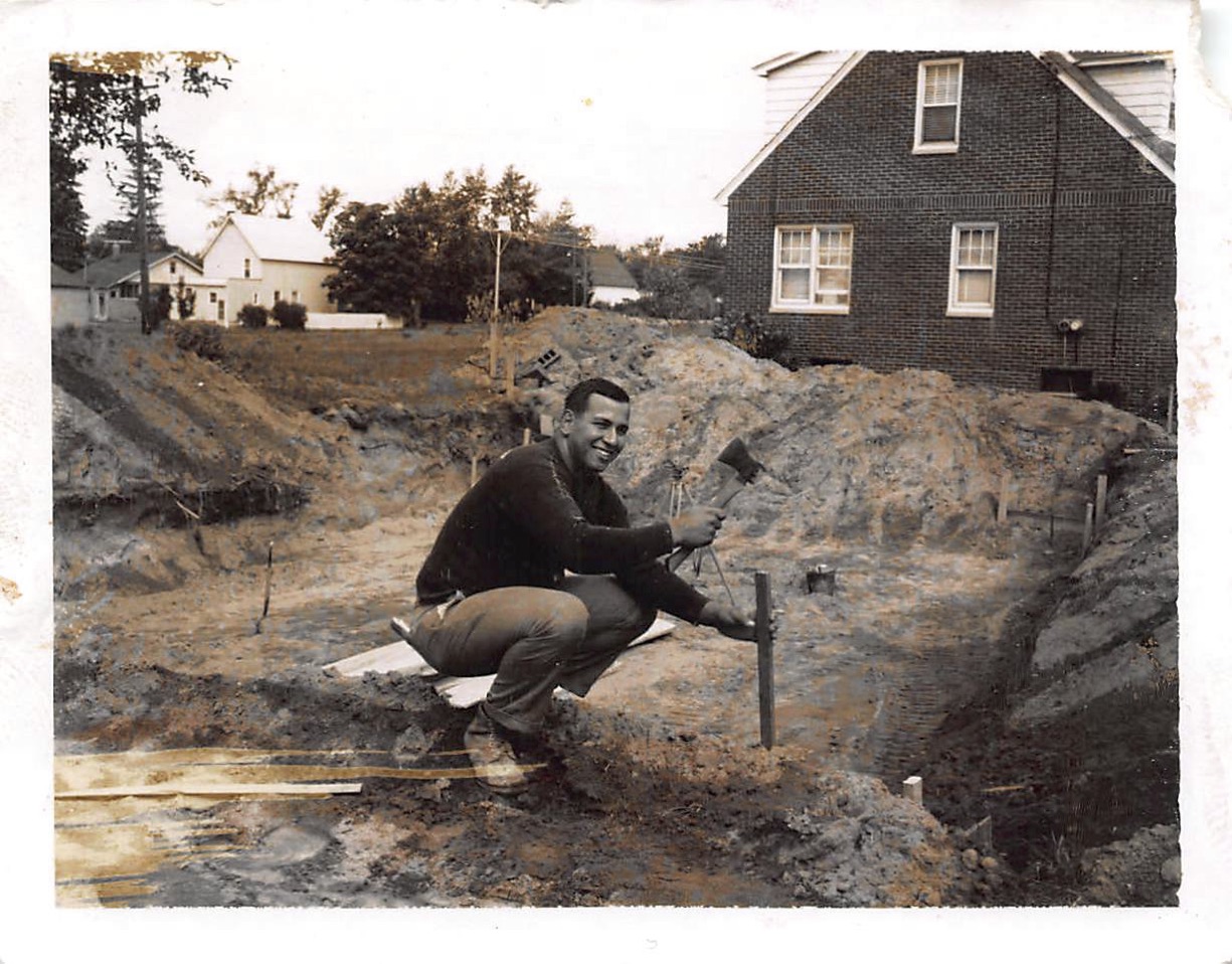 Dad building a house