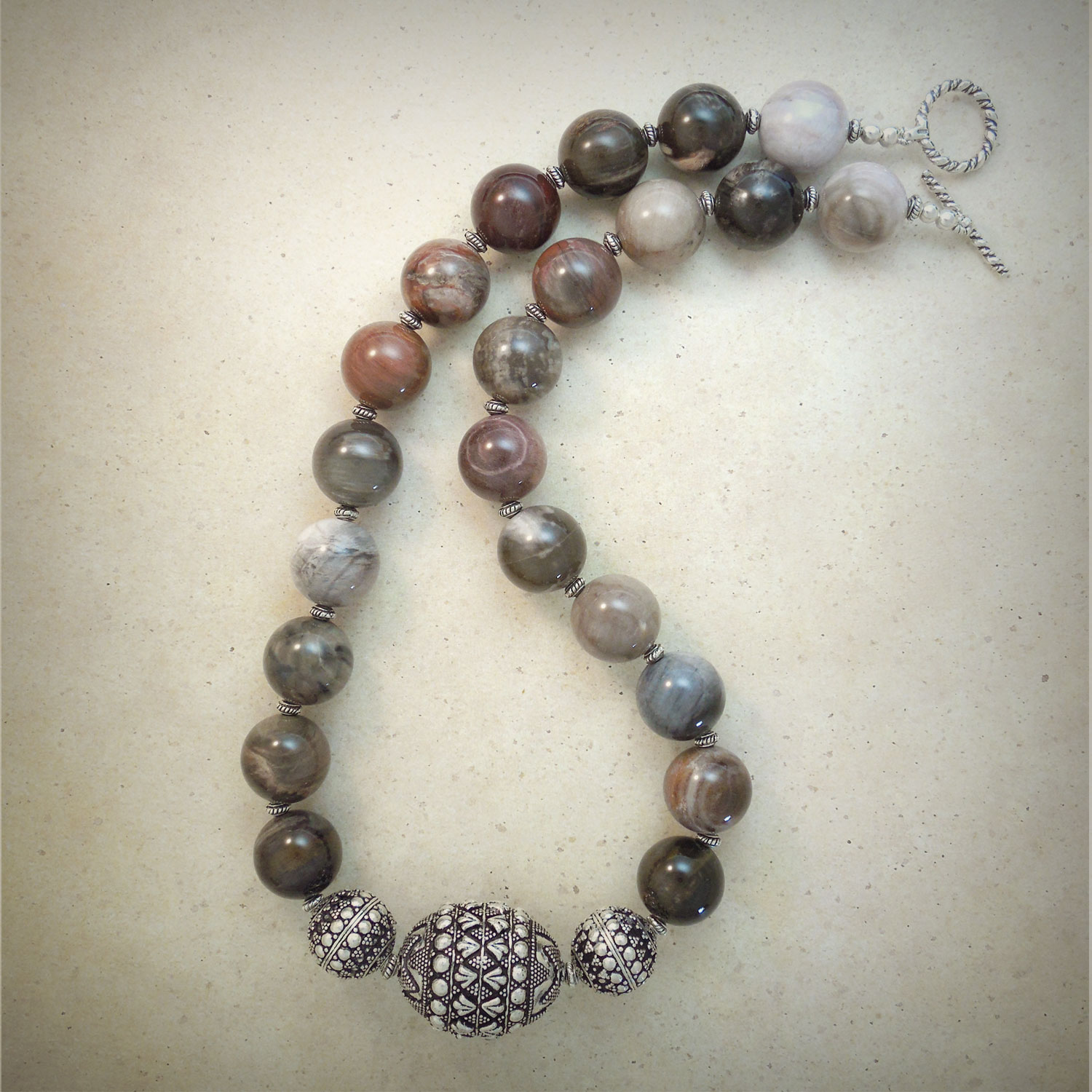 Petrified wood beads from Mongolia with sterling centerpiece beads