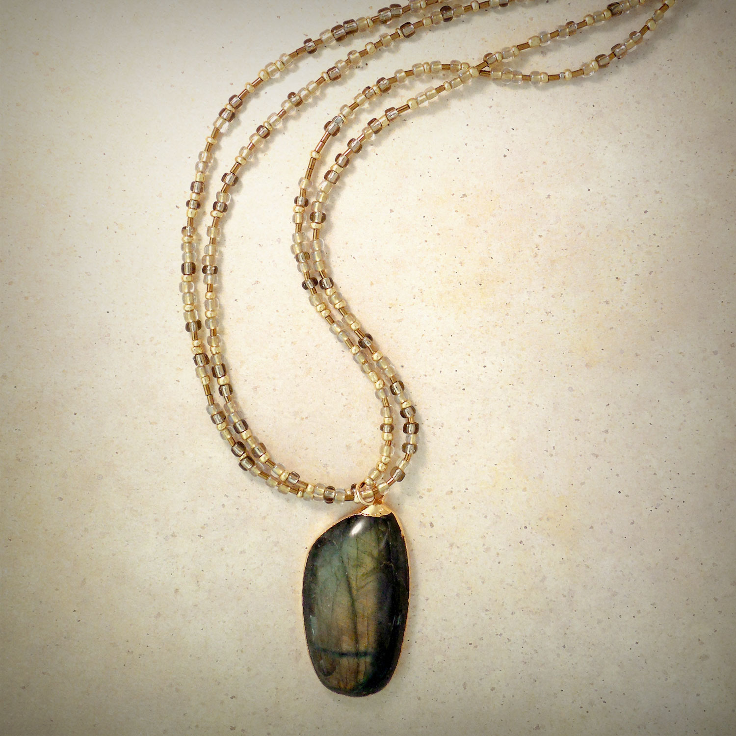 Green labradorite pendant with multicolored gold foil beads