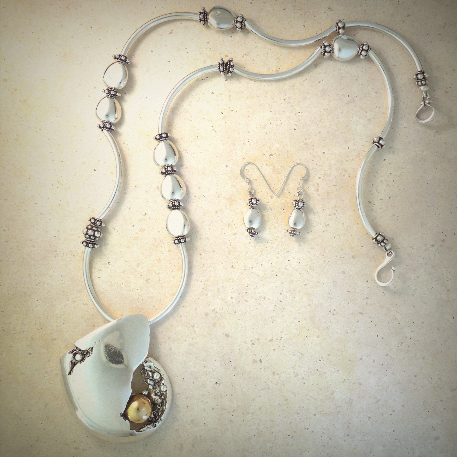 Freeform asymmetrical sterling pendant on sterling silver