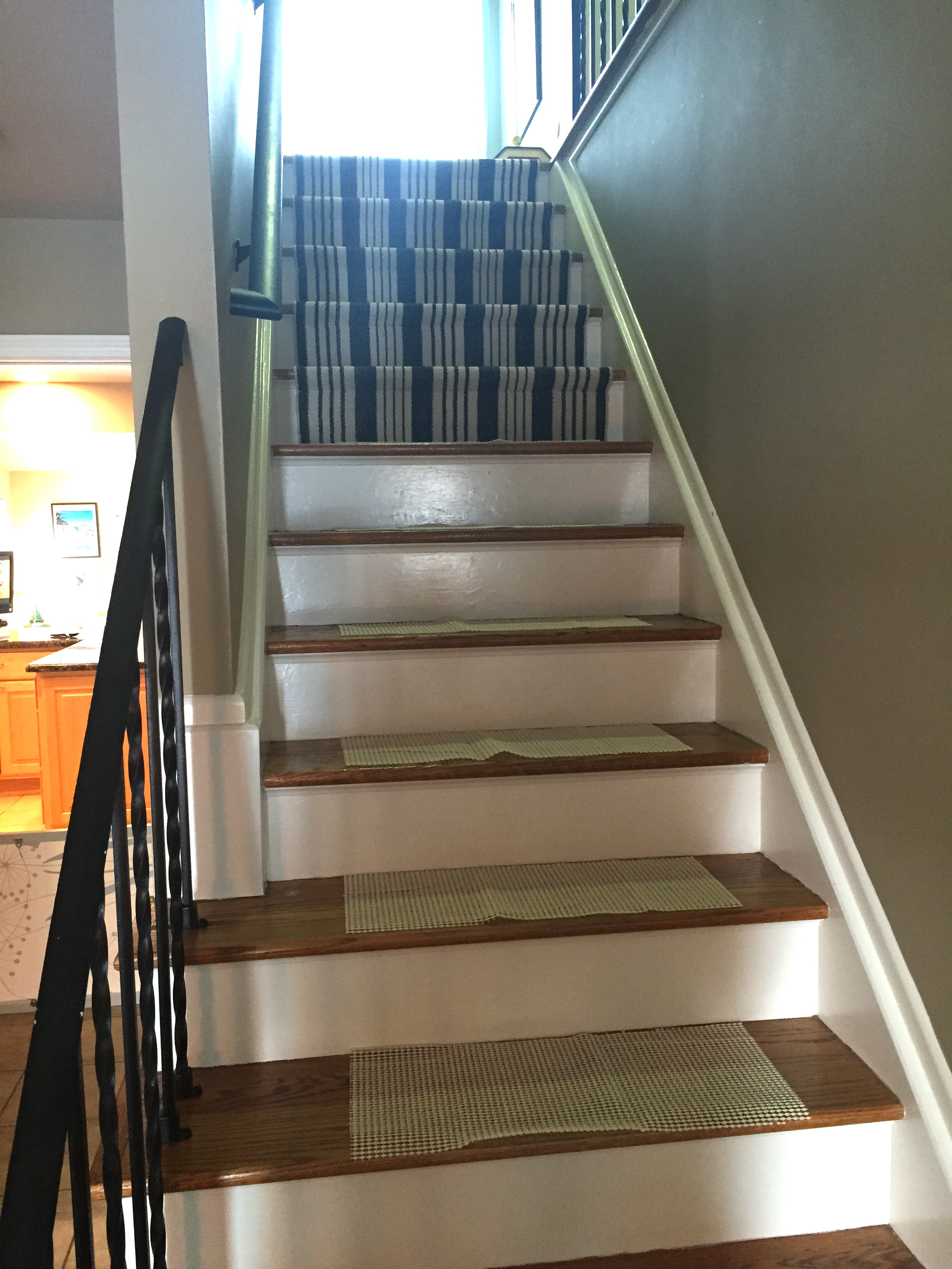 Rug pads were cut into strips and then secured down with tape.