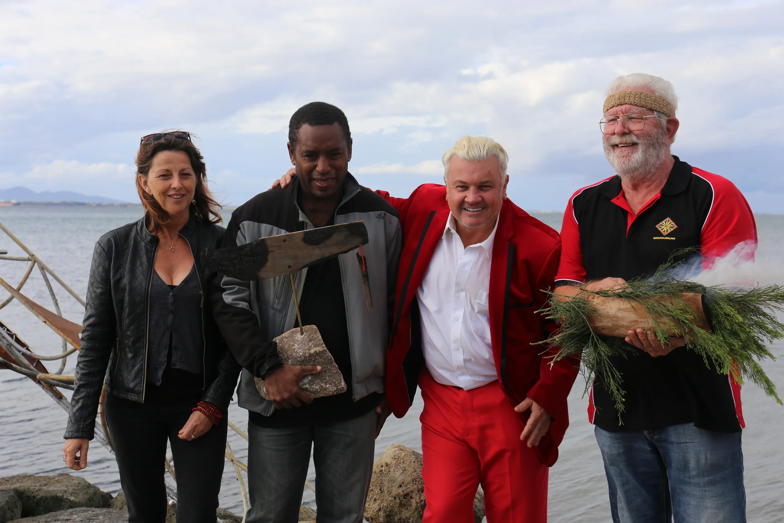 Canoe artists Mahony Maia Kiely and Leonard Tebegetu with Geelong Mayor Darryn Lyons and Wadawurrung Elder Uncle Bryon Powell at the Eastern Beach ceremony.