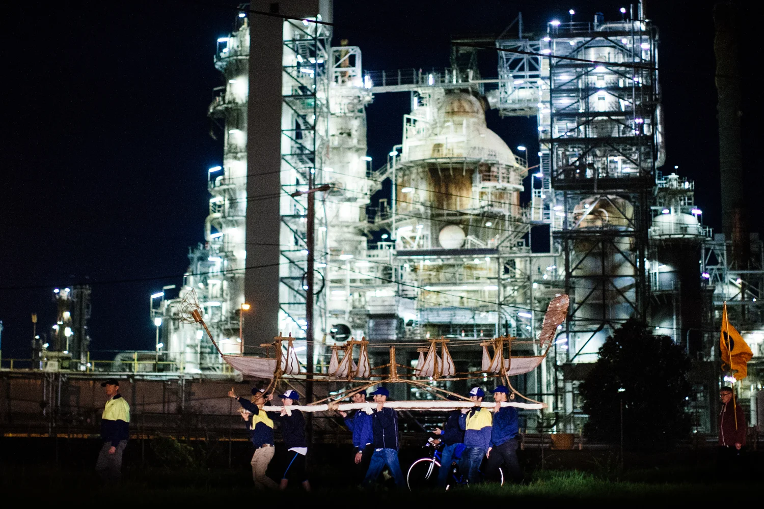 Ford factory workers carrying Canoe through industrial Geelong.  Image by Dean Walters Photography.