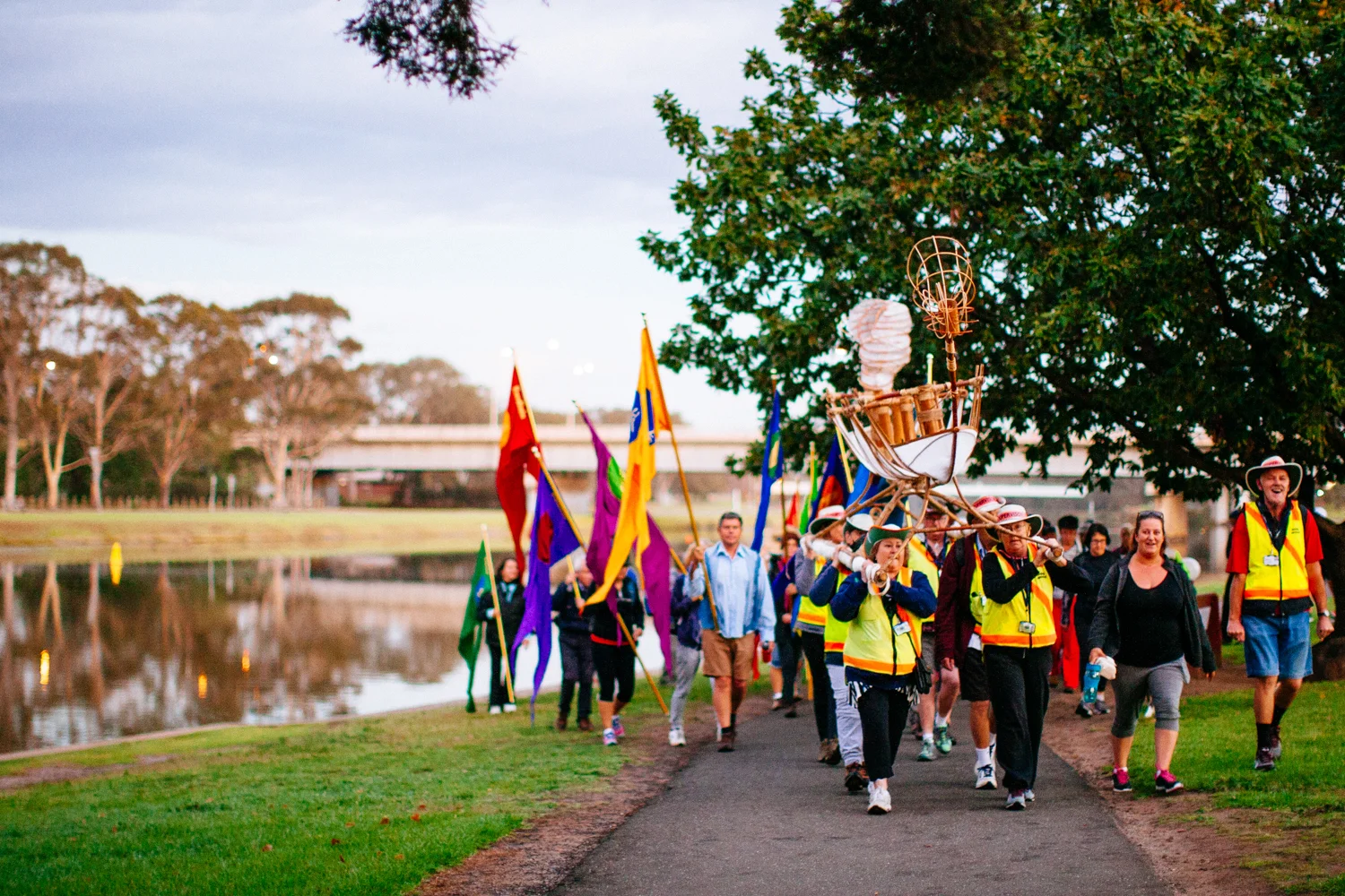 Crossing supervisors carrying Canoe alongside the Barwon River towards Christies Rd.   Image by Dean Walters Photography.