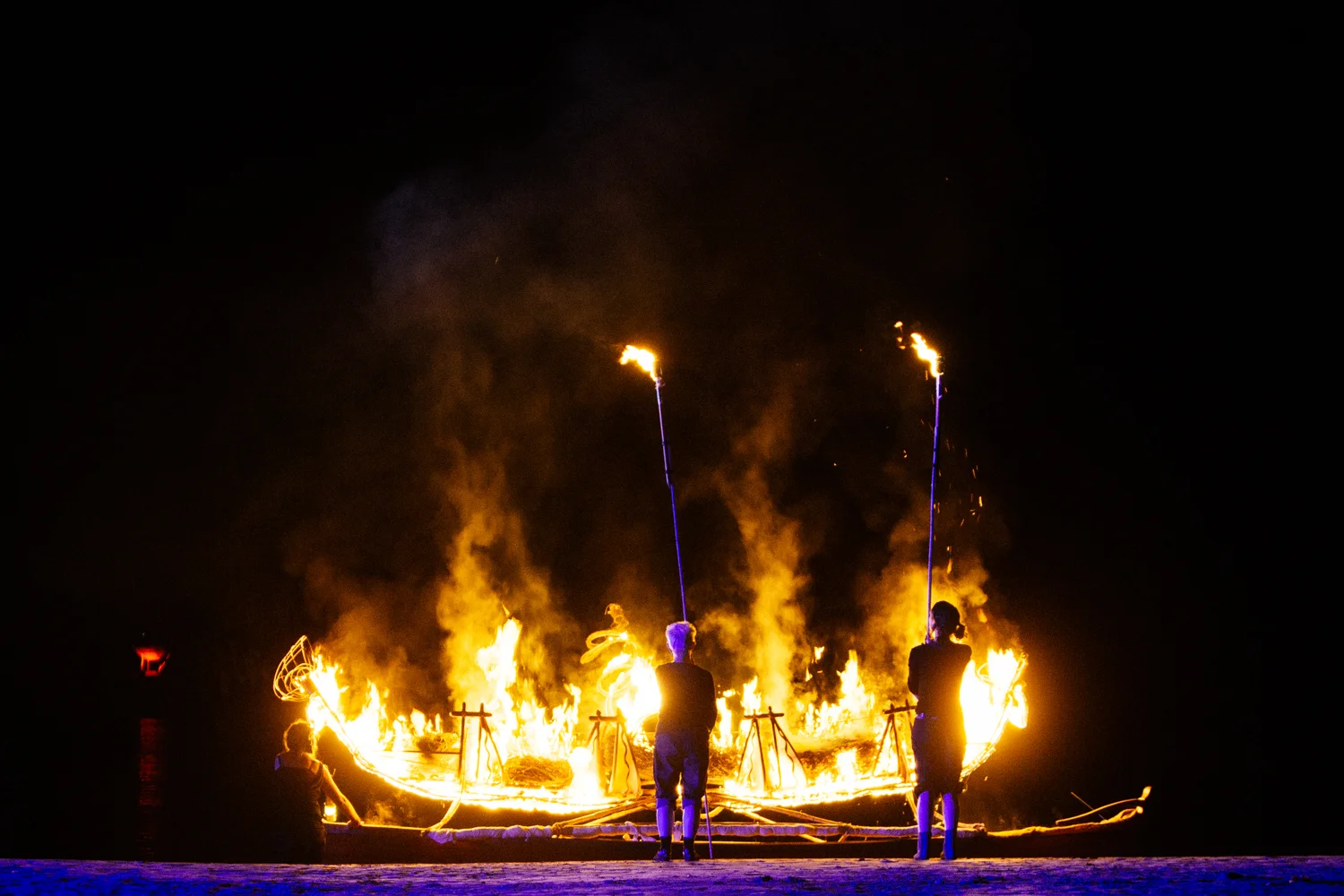 Canoe is set aflame.   Image by Dean Walters Photography.