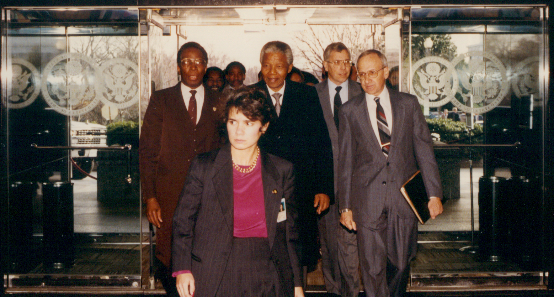 The late South African president Nelson Mandela, recently released after twenty-seven years in prison, enters the State Department with Cohen at the beginning of his first official visit to the United States in March 1990.