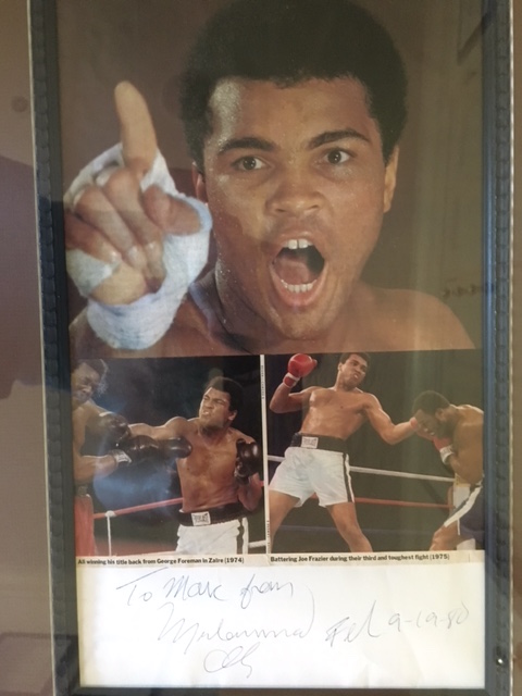 An autographed photo Ali gave to my son during his visit in Dakar.