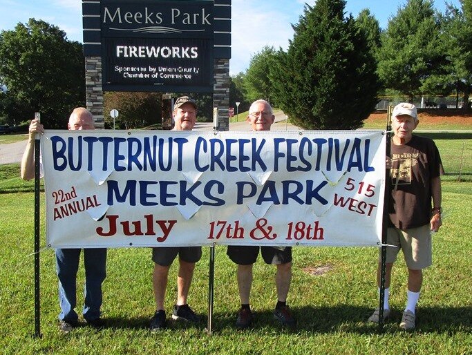  Putting up ther banners for the 2021 Butternut Creek Festival 