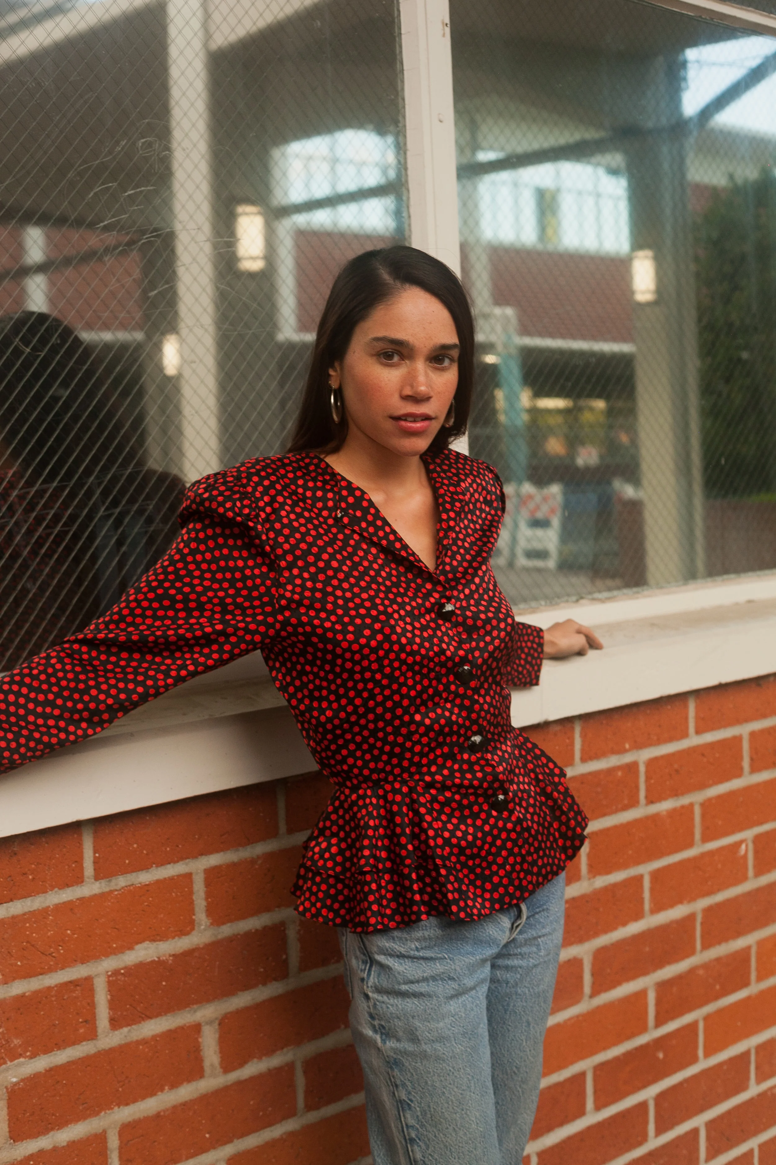 red polka dot blouse